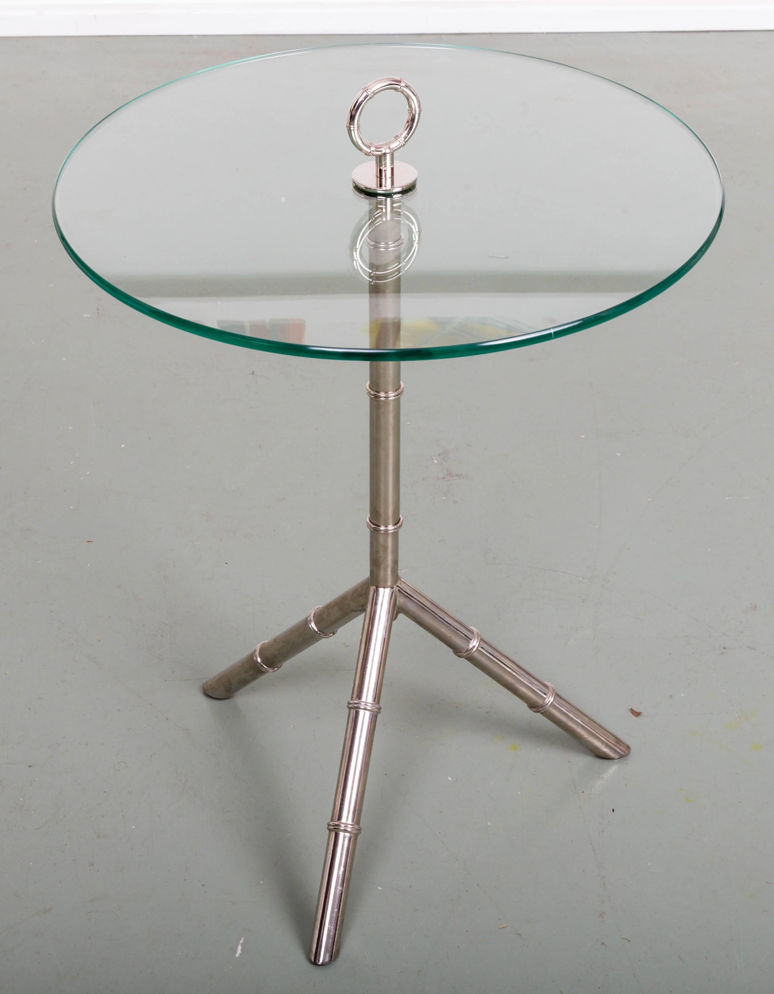 Small glass top side table with a faux bamboo chrome tripod stand with a round chrome handle.
Note: 24 inch height is to the top of the glass. The handle is 3.5 inches above.