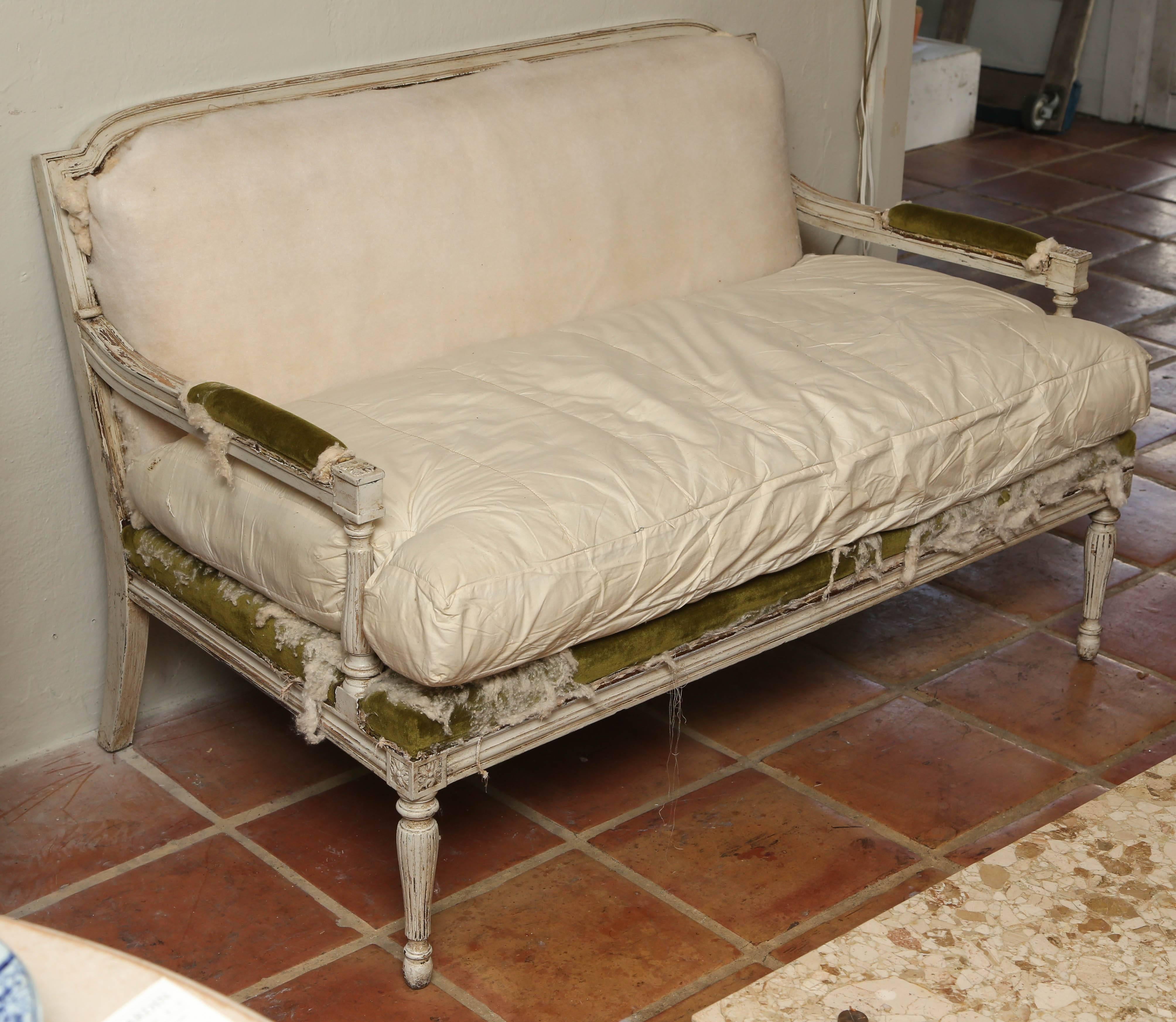 Hand-painted, French settee, circa 1900, the frame is pretty solid paintwork has lots of wear, and would need recovering, we have the cushion which is horse hair inside I believe.
Sits on turned fluted legs, also has the same arms, would look great