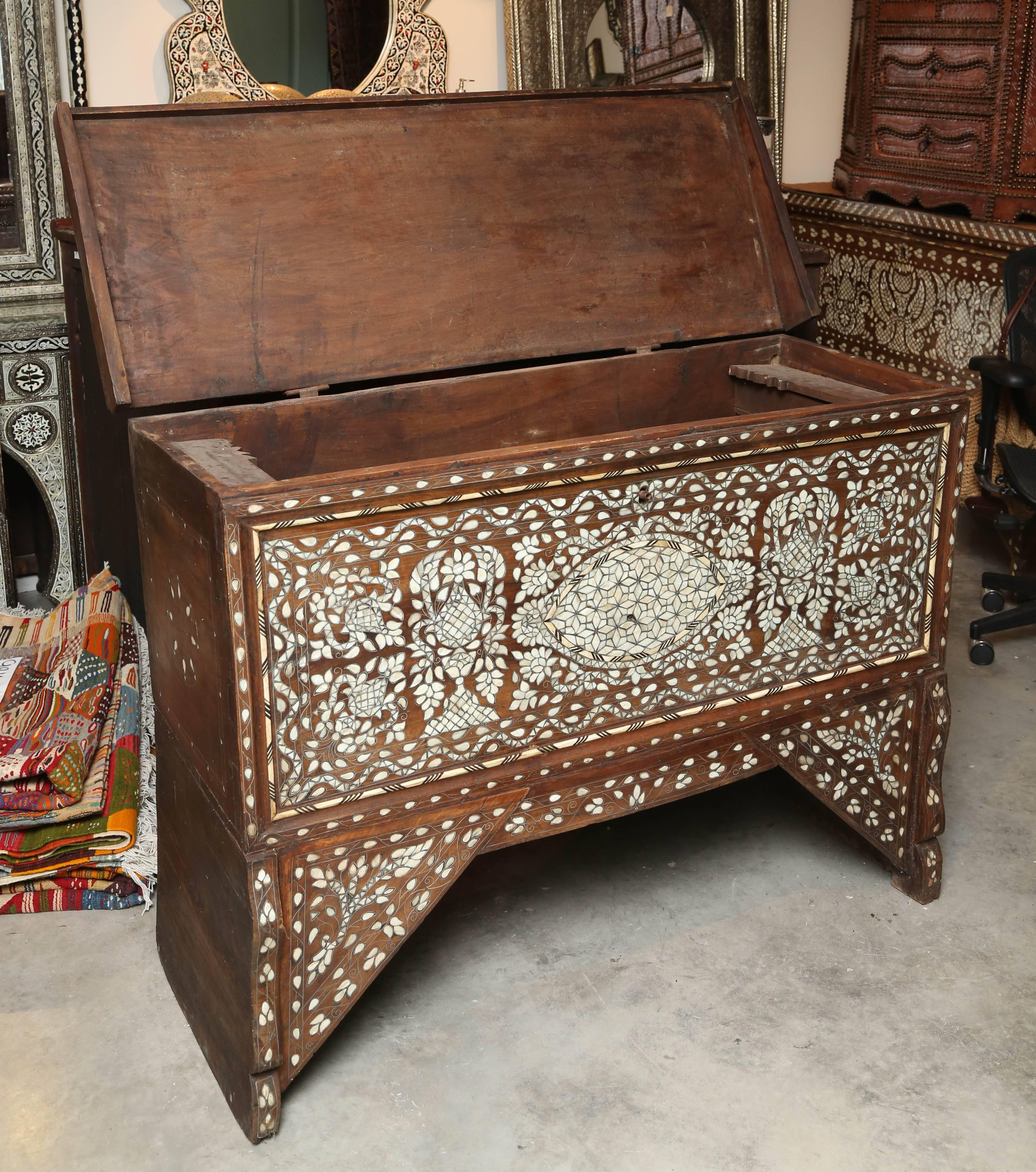 Mother-of-Pearl wedding chest from Syria. Intricate mother-of-pearl and camel bone inlay. One-of-a-kind Moorish geometric design.
Measures: 52 3/4 W x 20 1/4 x 39 3/4 H.
