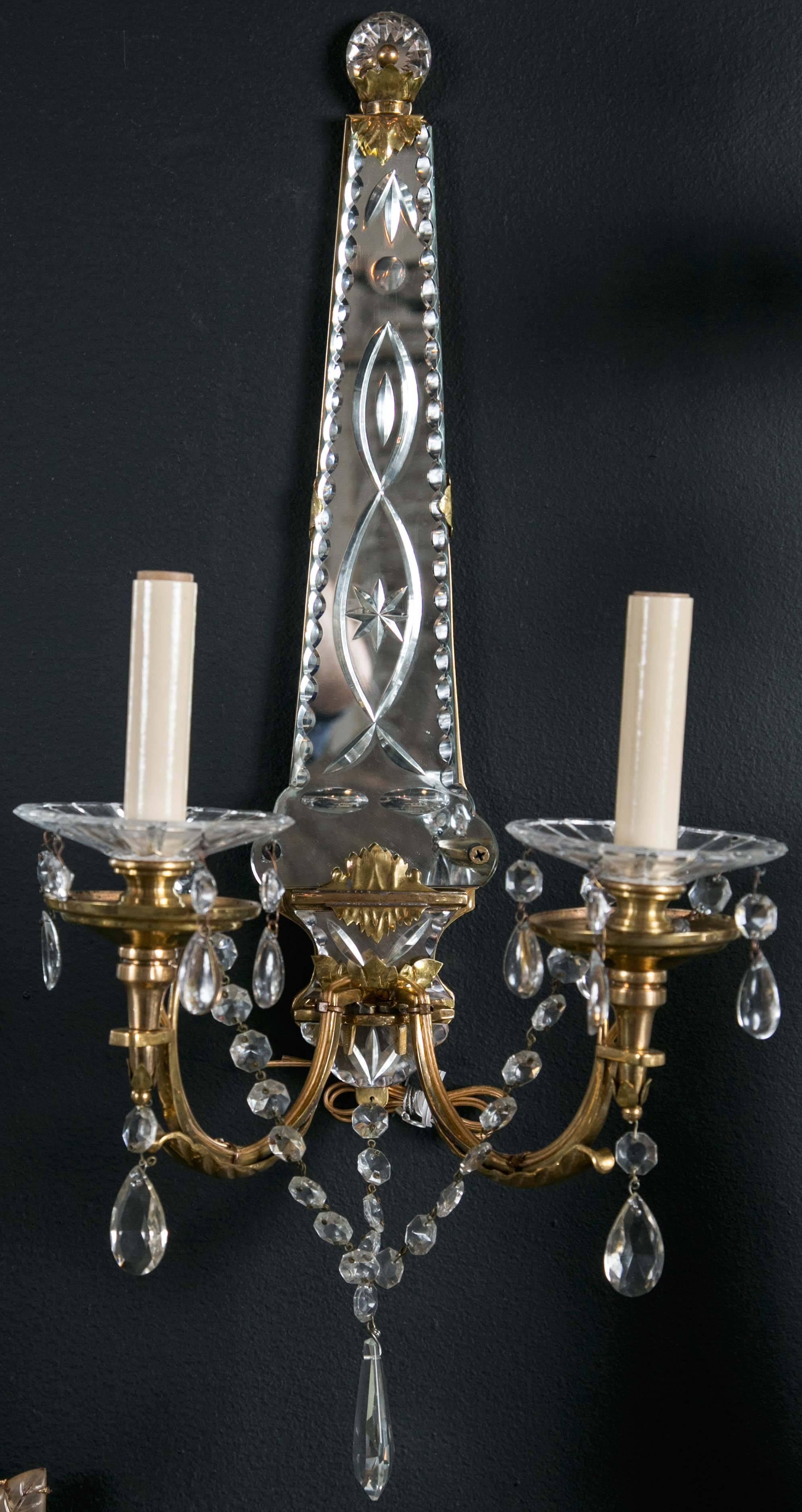 A set of eight, circa 1930s, French gilt bronze sconces with etched mirror backplate; $6,800 per pair, four pairs available.