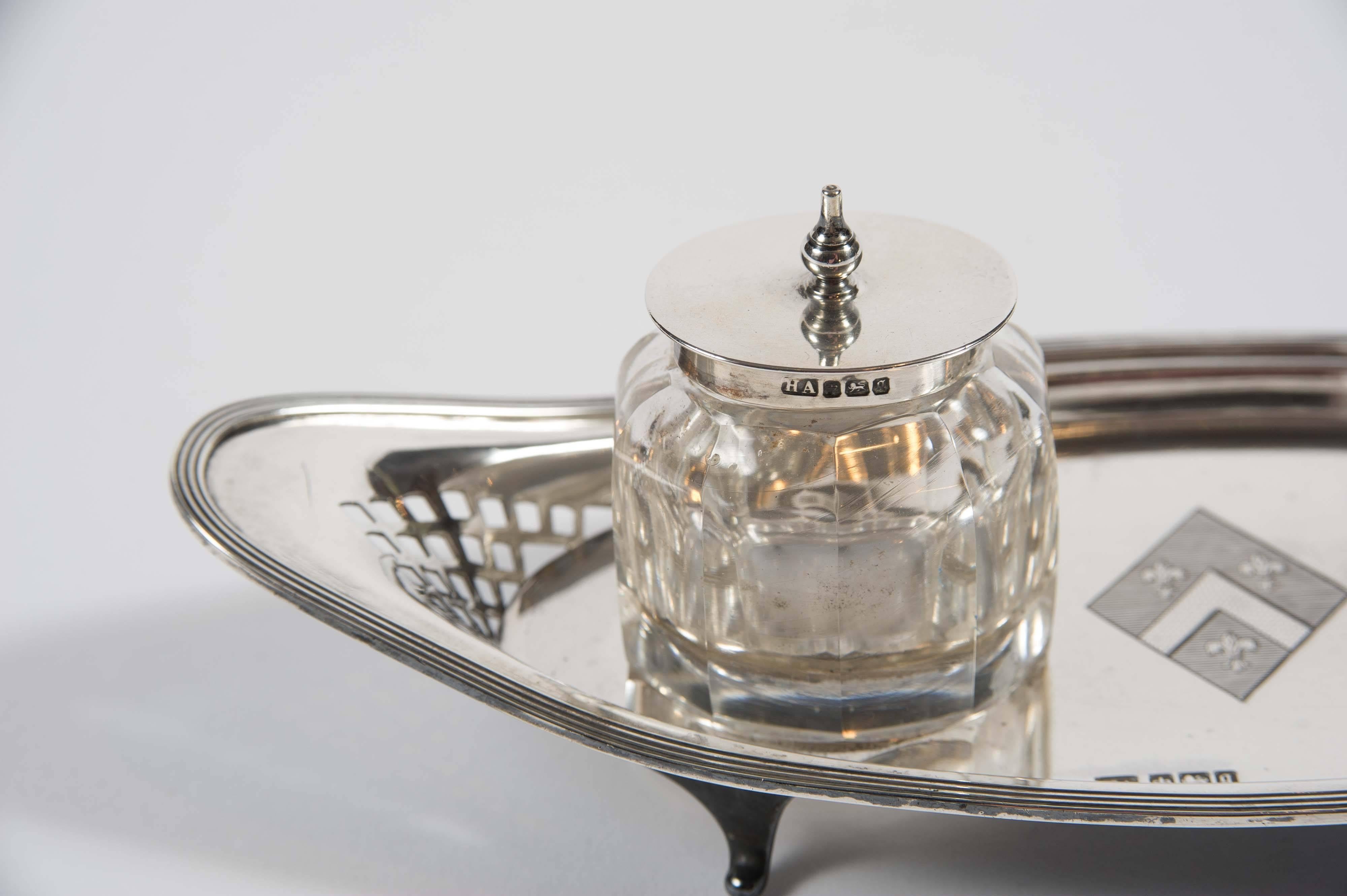 This charming example with its two original glass inkwells; the tray and both lids hallmarked Sheffield, silver, 1908 and makers mark of 