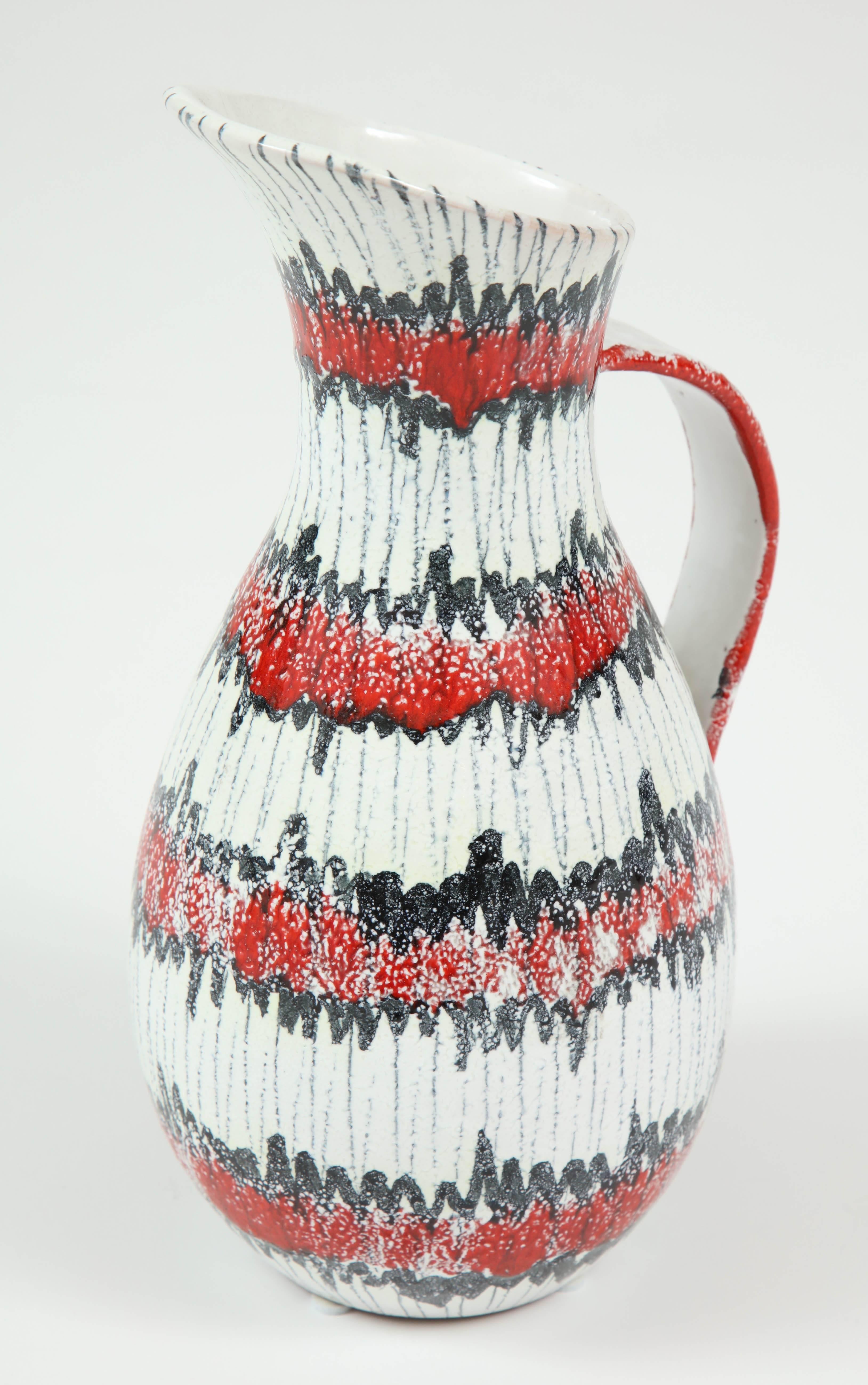 Ceramic, midcentury pitcher from Italy, circa 1950. The color is red, white and black. Good condition.