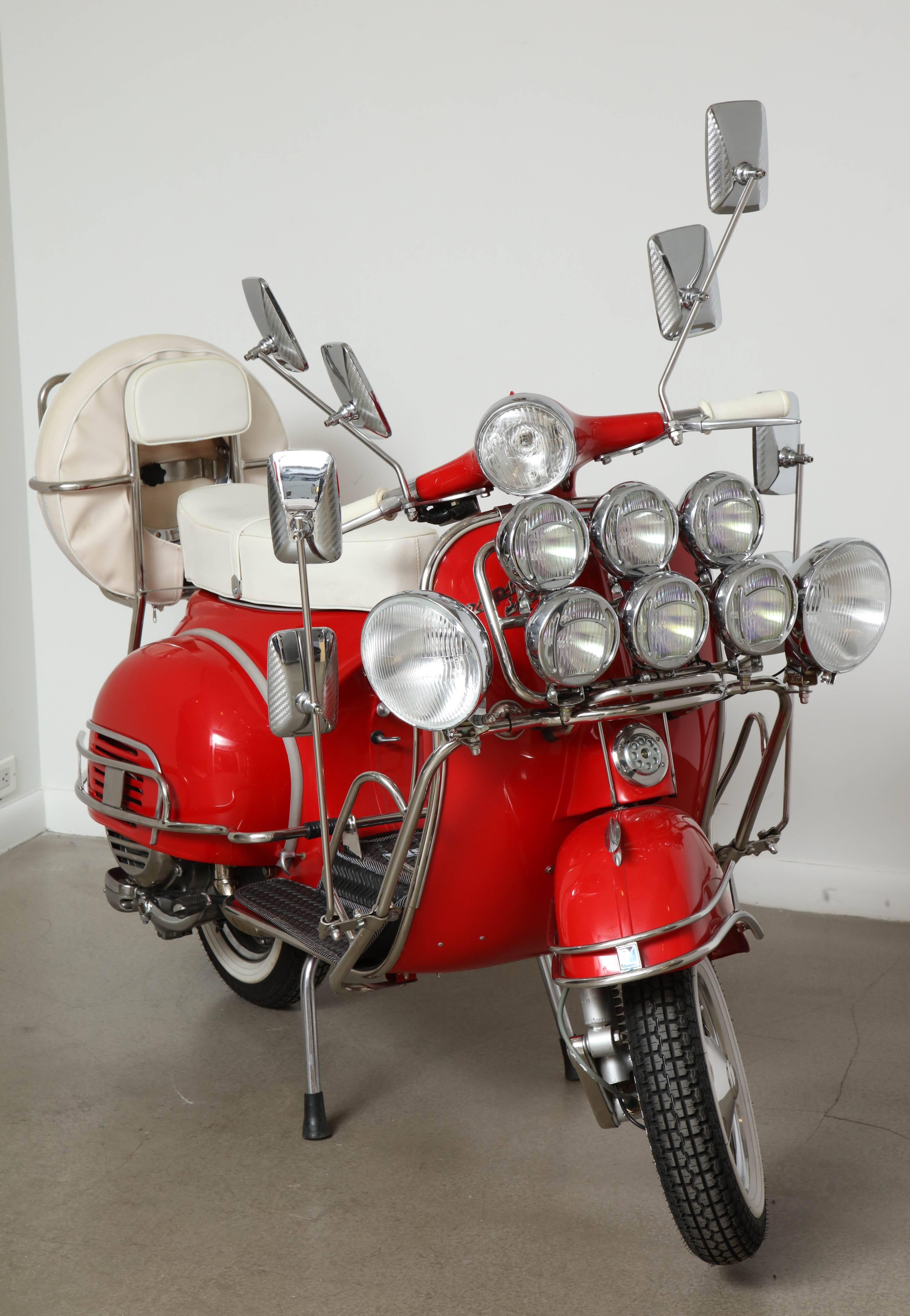 Meticulously restored 1963 vintage Italian, Piaggio Vespa VBB Standard 150cc with super "Mod" (modernist) styling in Candy Apple Red. Chassis No: VBB2T167241. This is an immaculately restored Mid-Century modern piece of history that is