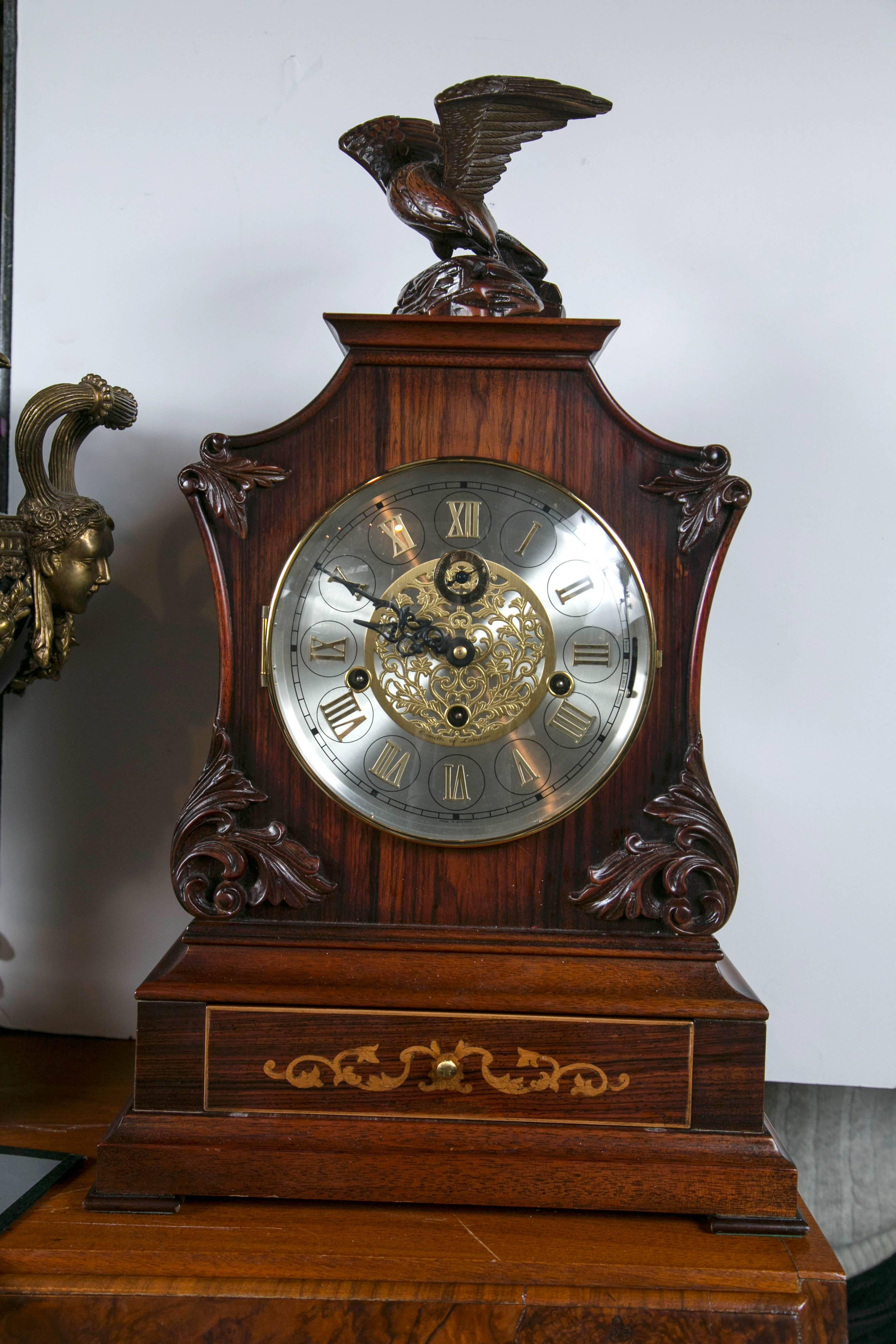 Topped by an eagle on a rock, this clock dates from the late 20th century. It was made in Germany by Franz Hermle. 11 jewels, unadjusted. It was sold in London by O. Comitti and Son Ltd. . It is a triple chime with lever escapements. Comes complete