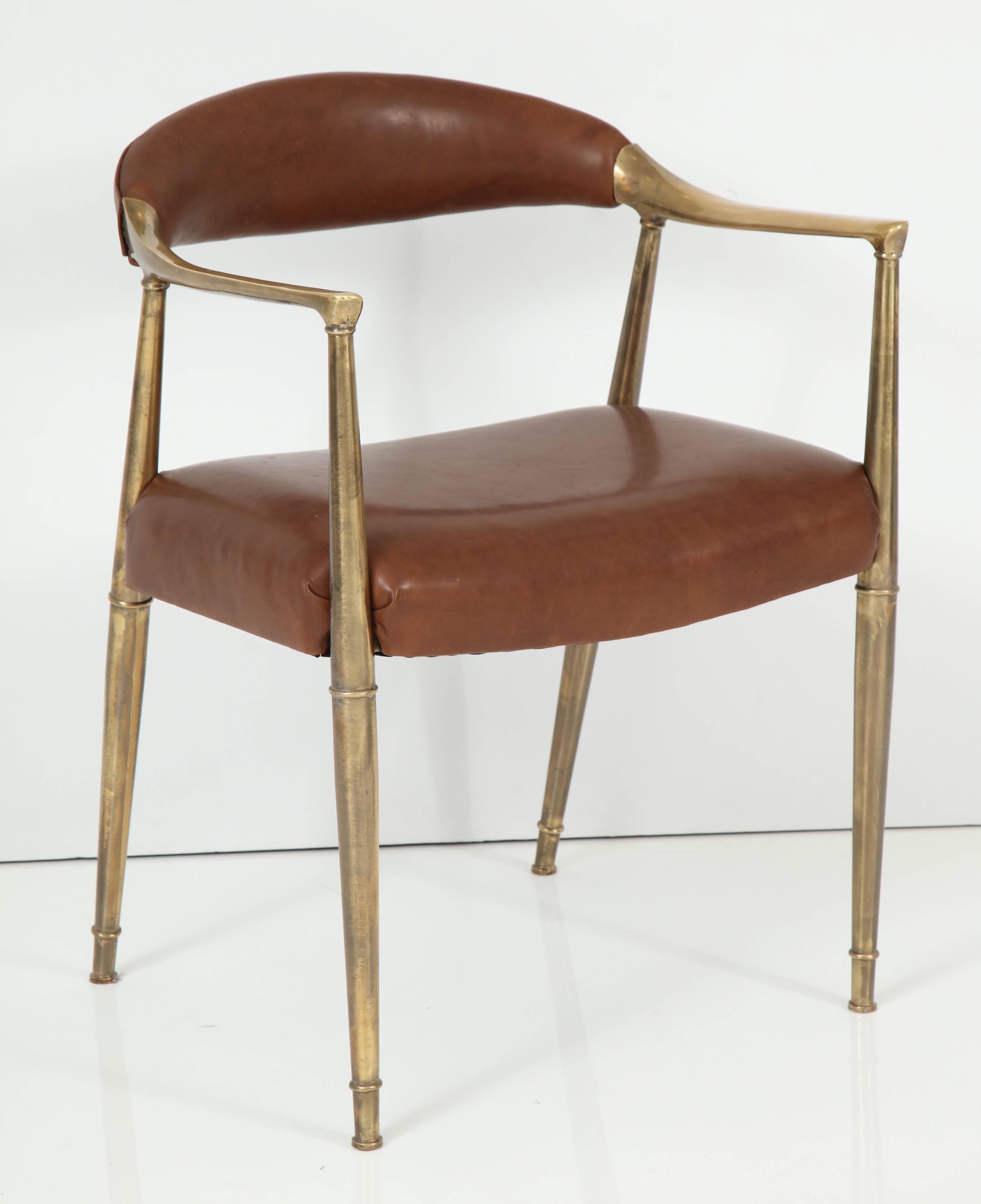 Elegant solid brass armchair, Italian 1960s. Elegant form very reminiscent of the chair by Hans Wegner. Newly upholstered in saddle leather; beautifully repolished brass retains rich natural age patina.