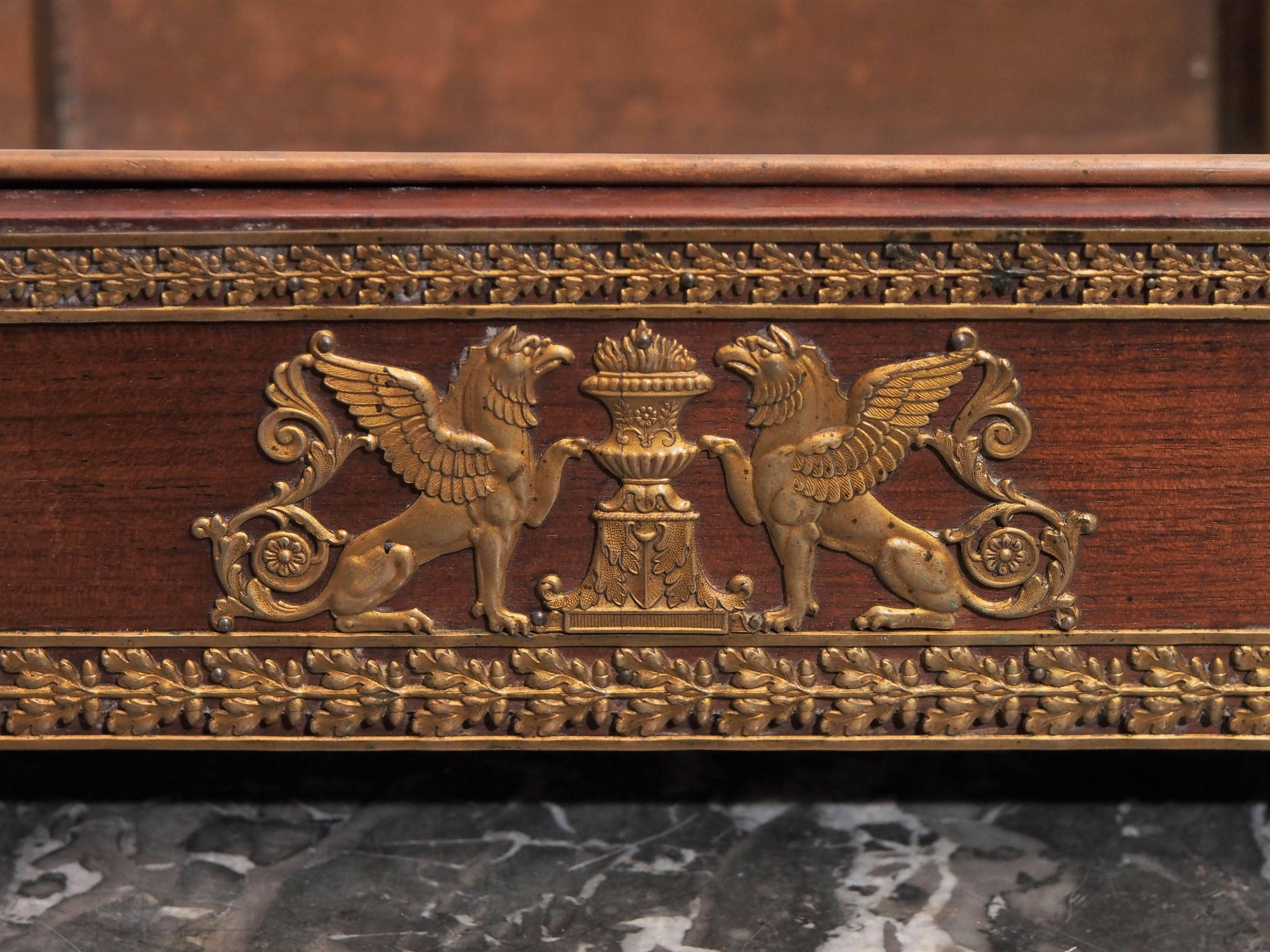 French Empire gilt mounted mahogany Jardinière with typical Empire motif.