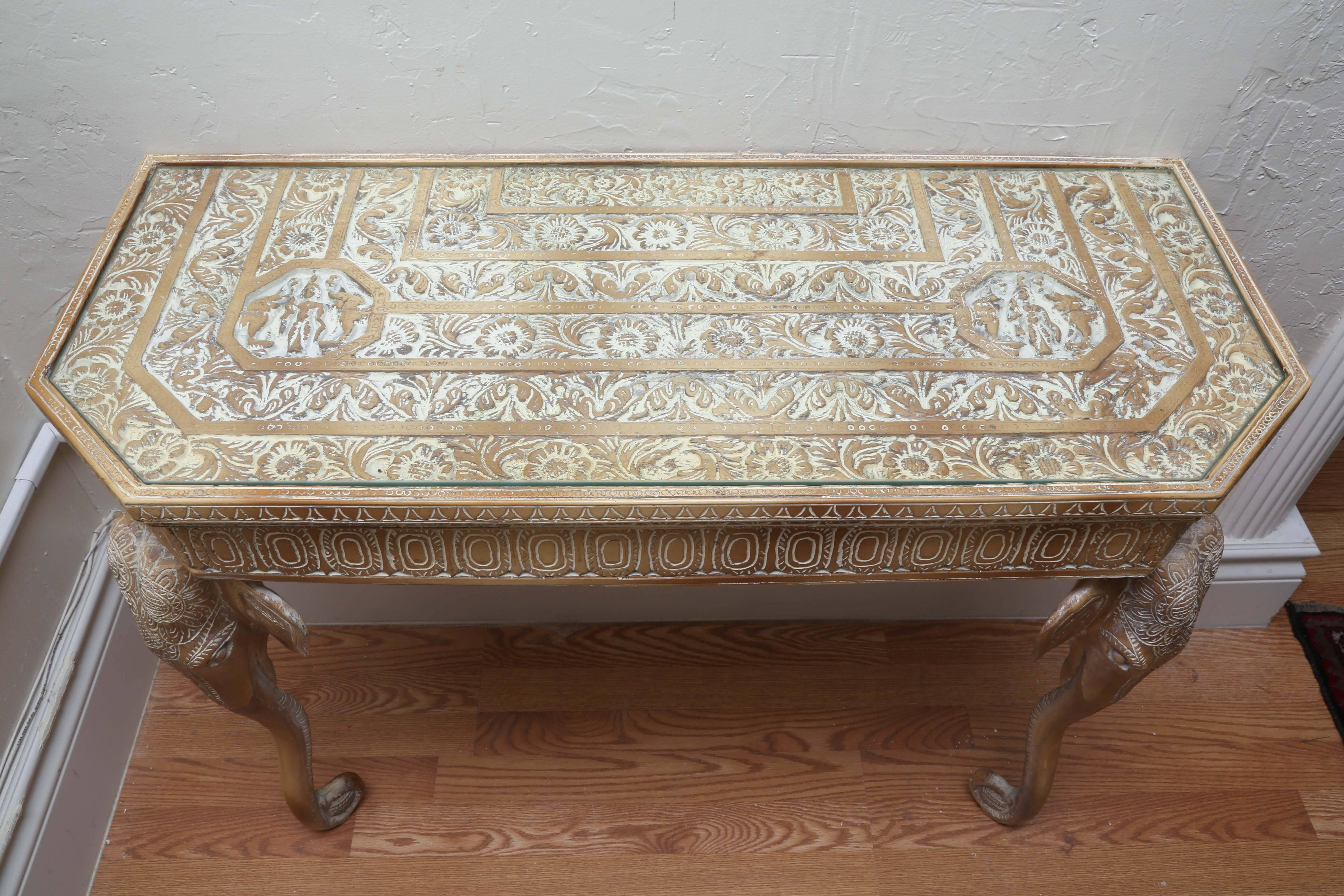 Very attractive and unique elephant console with glass top. Back attaches to wall and is supported by two elephant trunks.