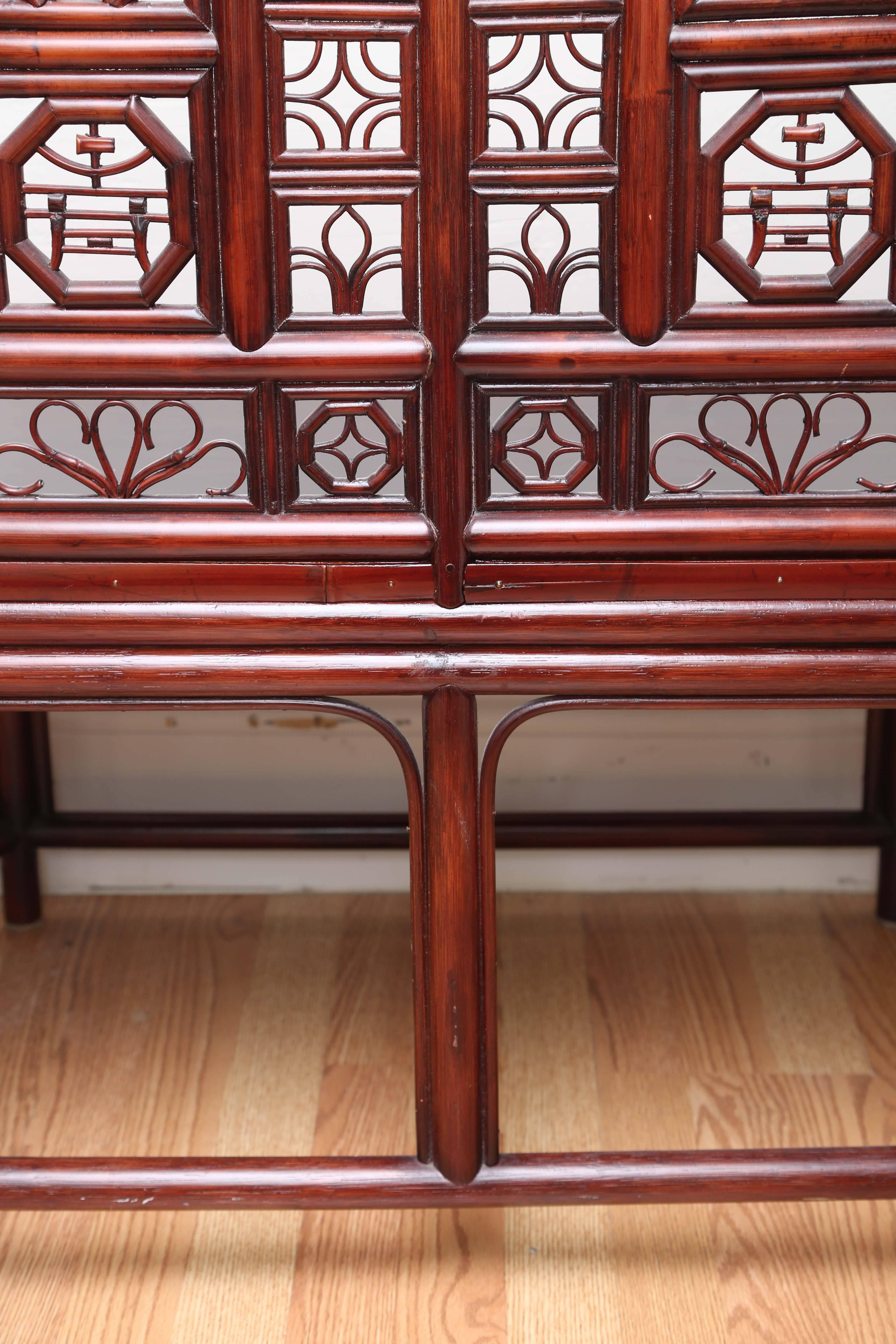 Charming pagoda style Asian loveseat with beautiful fretwork back and sides. Very fine detail. A beautiful entryway piece.