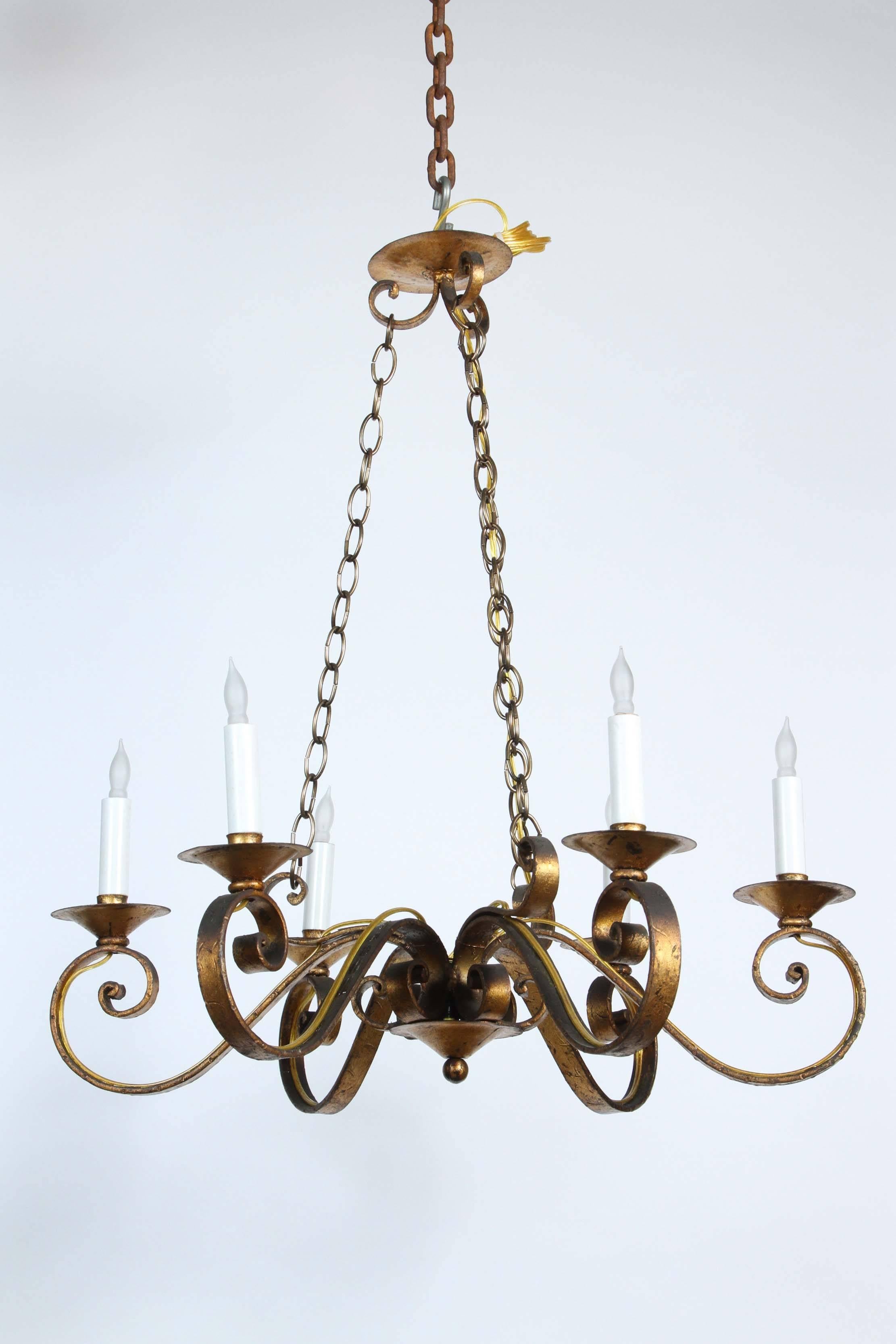 1970s six-arm golden wrought iron chandelier with canopy and chain. This chandelier has been re-wired. This can be seen at our 1800 South Grand Ave location in Downtown Los Angeles.