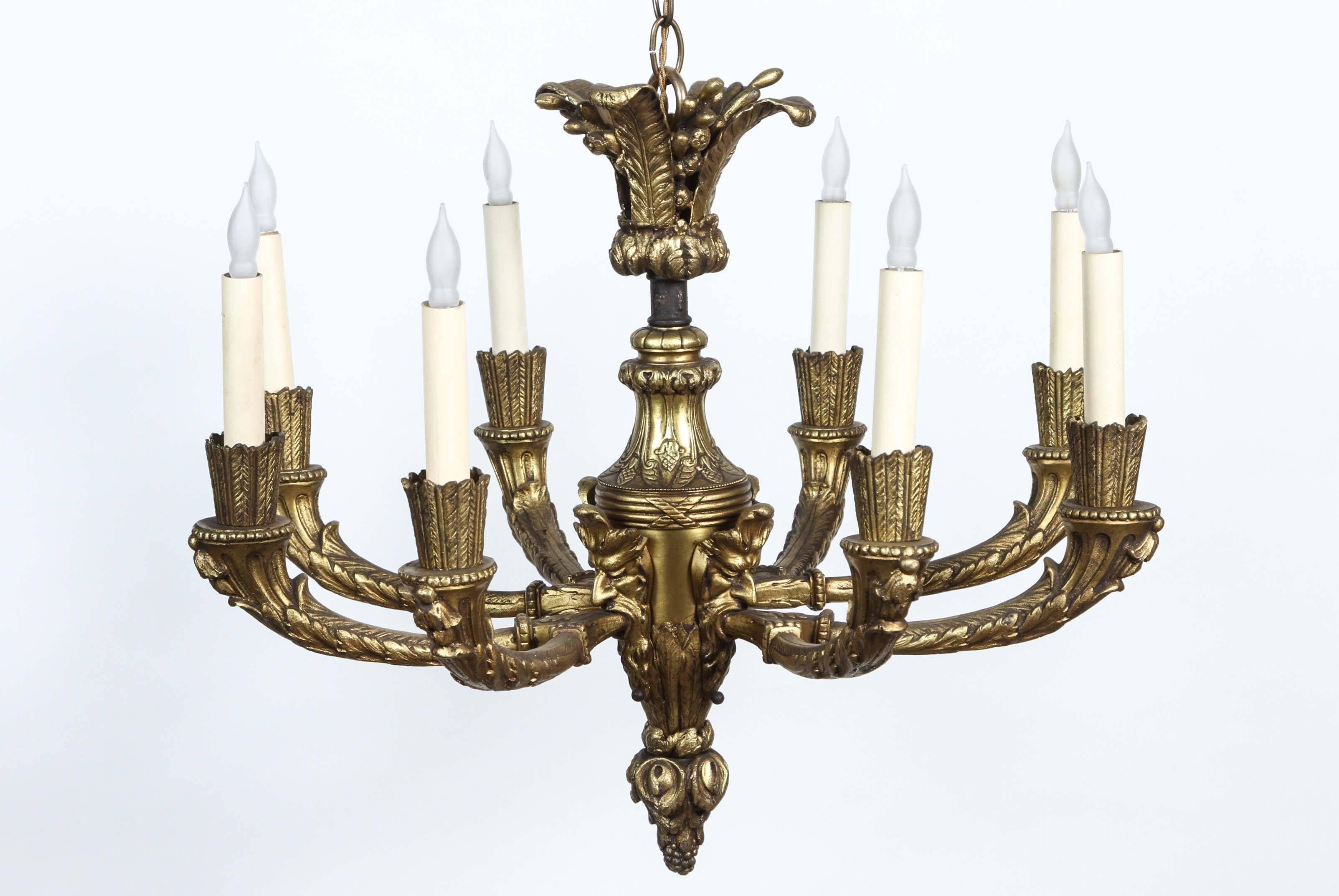 1920s, Bronze Eight-Light Chandelier with Four Grotesques from France In Excellent Condition In Los Angeles, CA