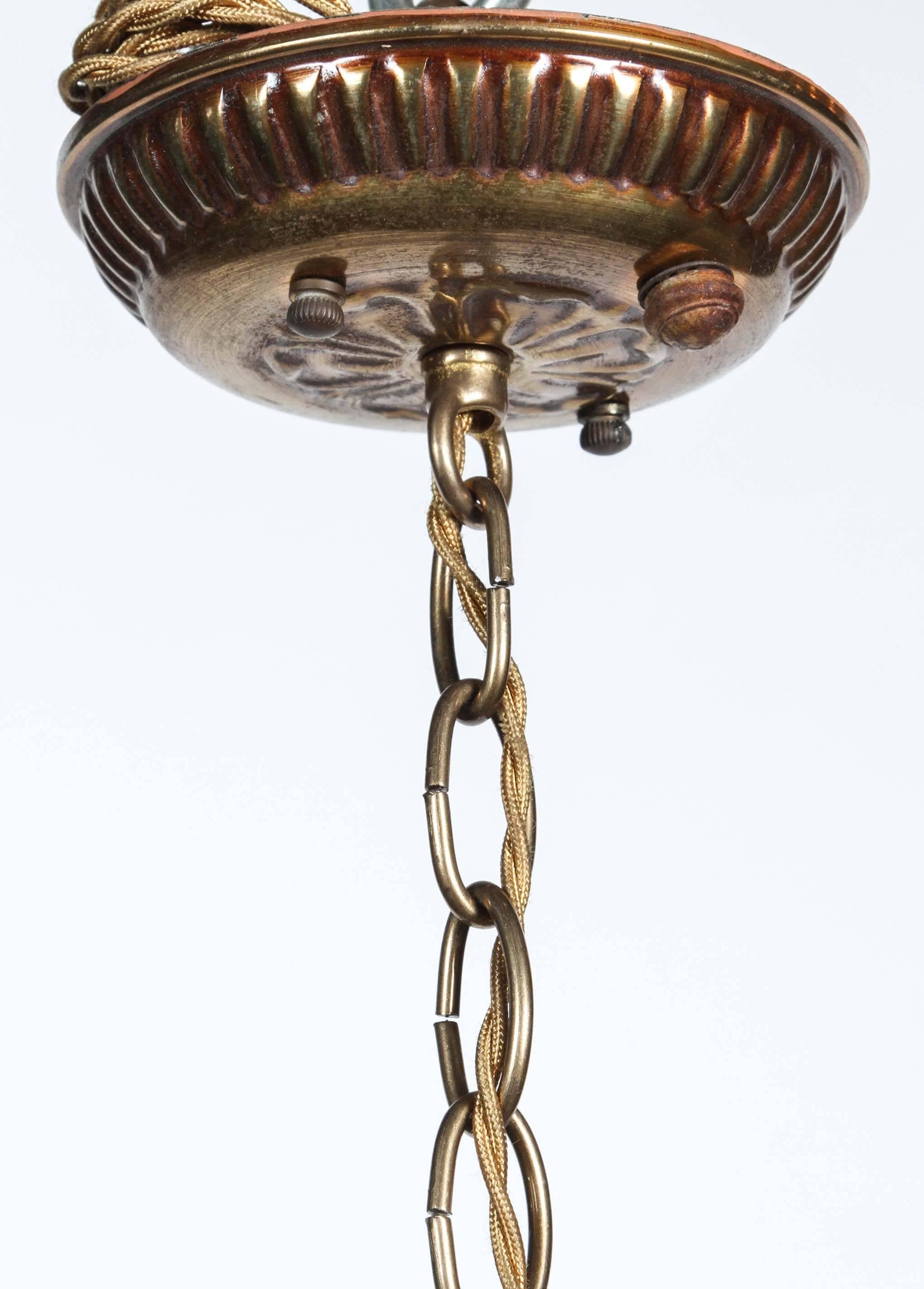 Early 20th Century 1920s, Bronze Eight-Light Chandelier with Four Grotesques from France