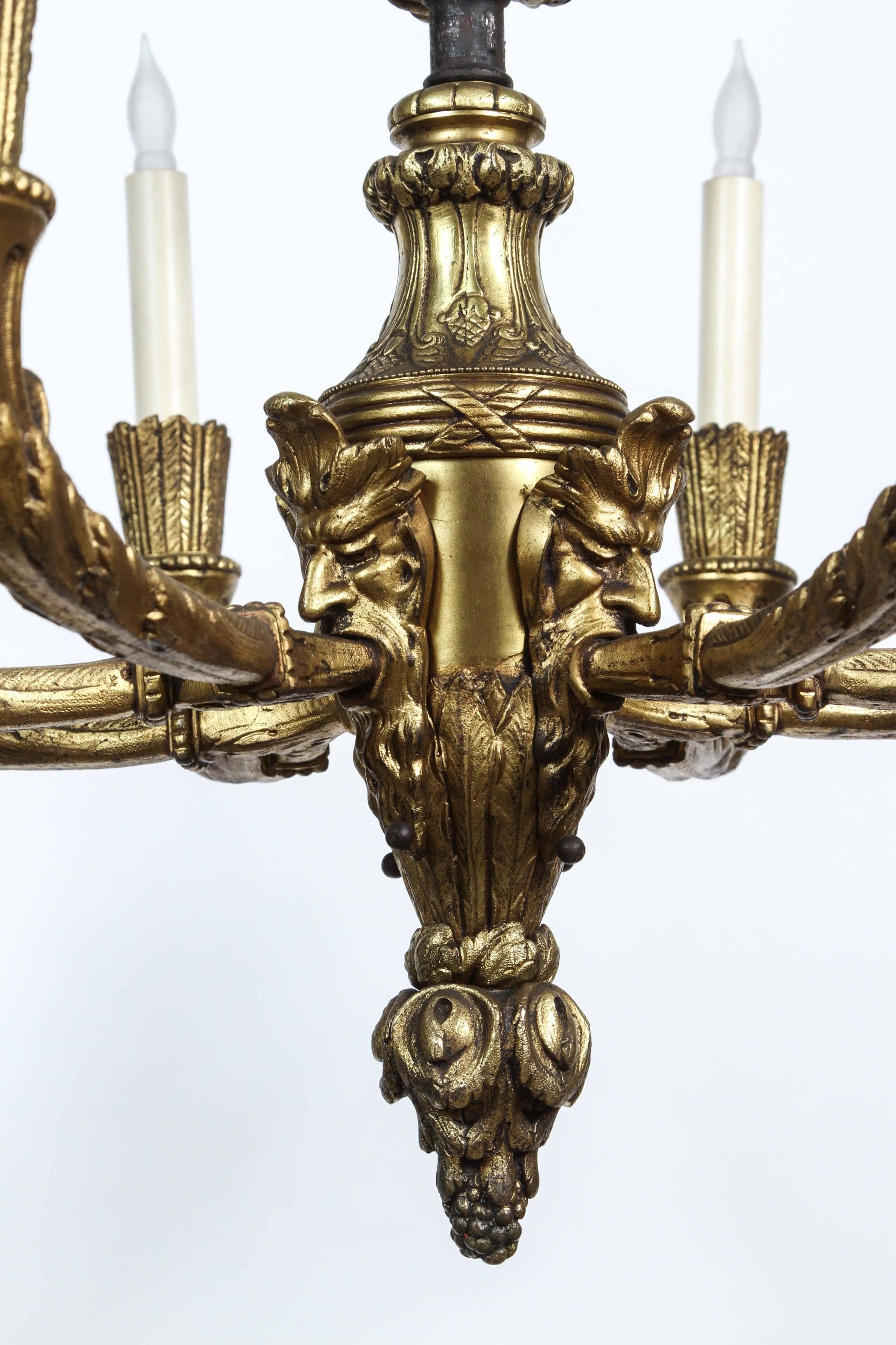 1920s, Bronze Eight-Light Chandelier with Four Grotesques from France 2