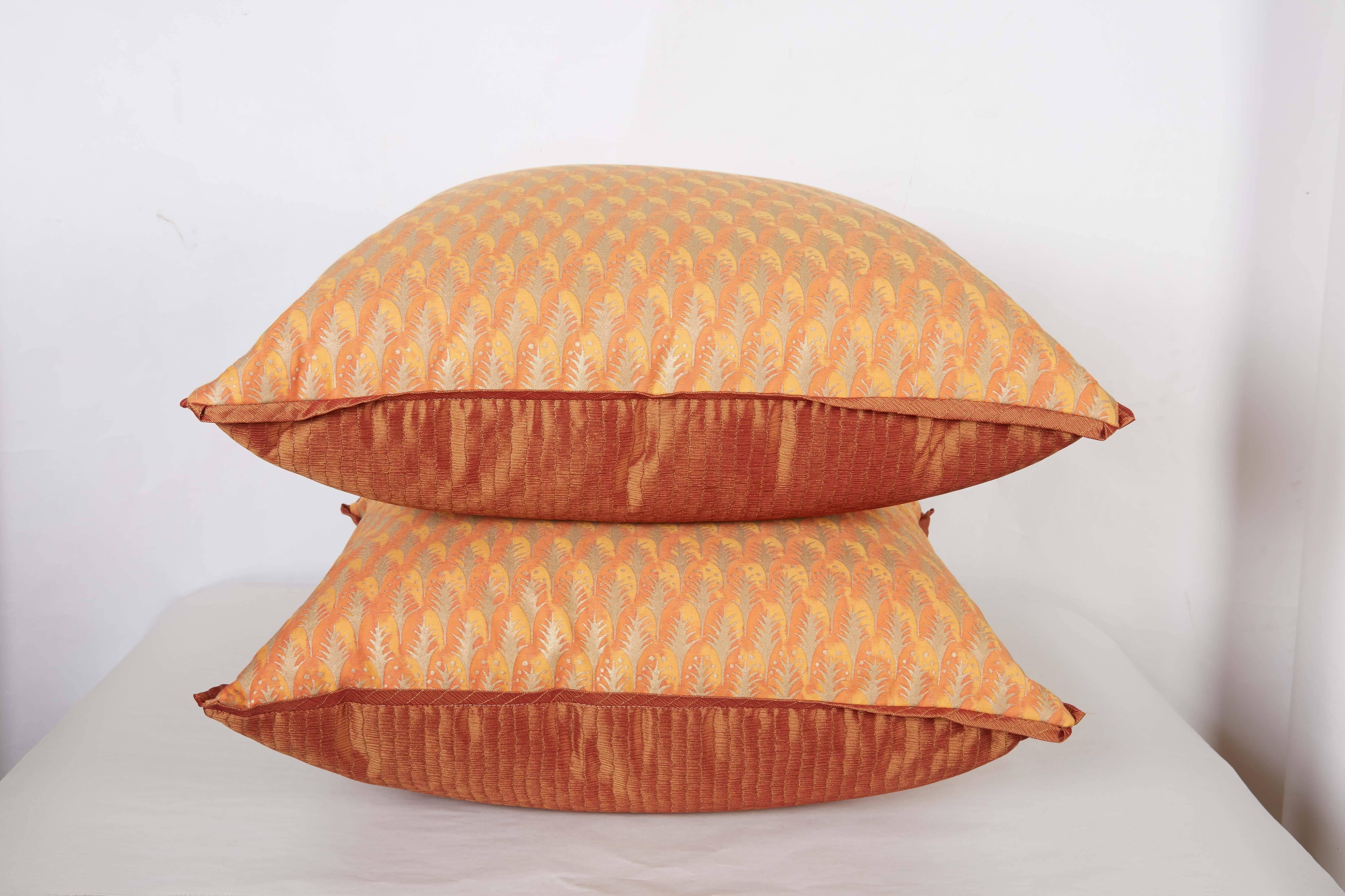 A pair of Fortuny fabric cushions in the Puimette pattern, apricot and silvery red color way, silk blend backing material with silk bias edging, the pattern, a 15th century Persian design with feather motif. Newly made.
50 down/50 feather insert
