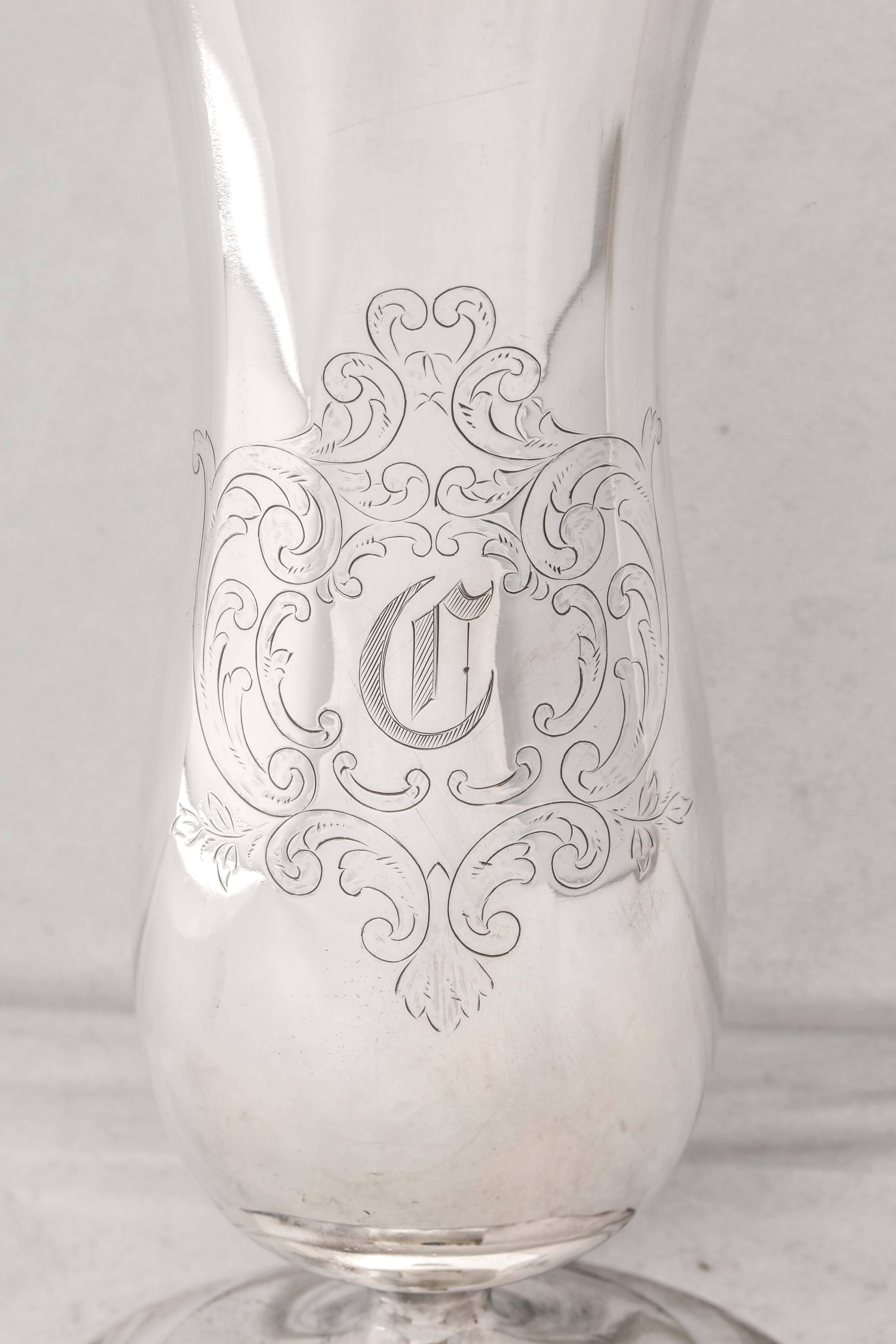 Edwardian, sterling silver vase, Frank M. Whiting & Co., Attleboro, Mass., circa 1910. Measures: 8 inches high x 3 1/2 inches diameter across base. Lovely etching surrounds a cartouche that has been monogrammed with an Old English letter ‘C’. Dark