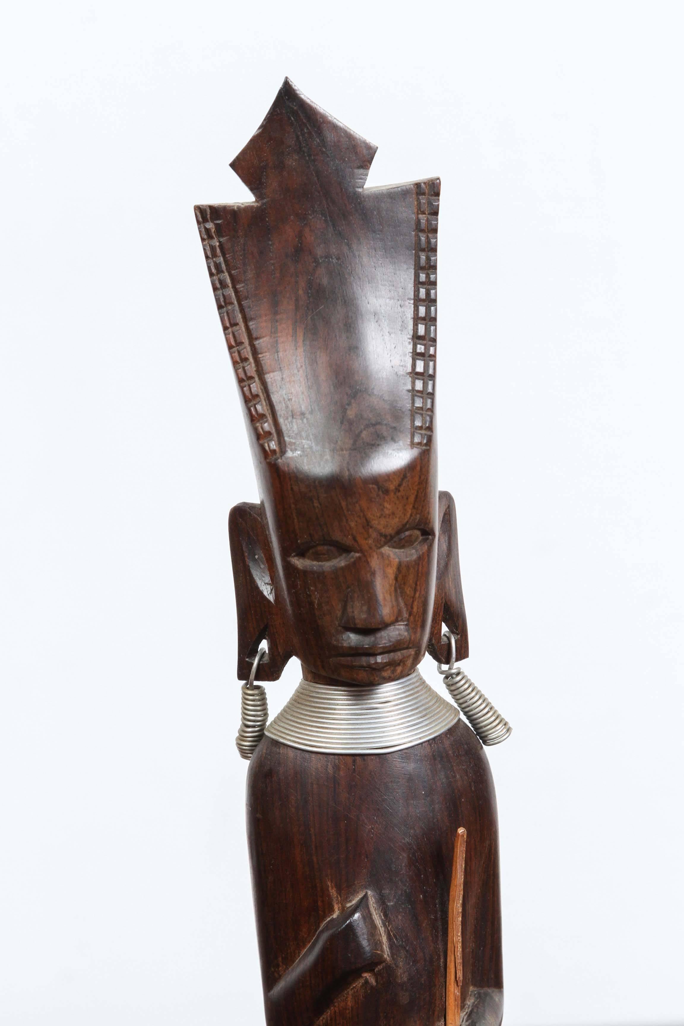 Decorative ebony impressive hand-carved African statue from Kenya.
Nice details with metal earrings.