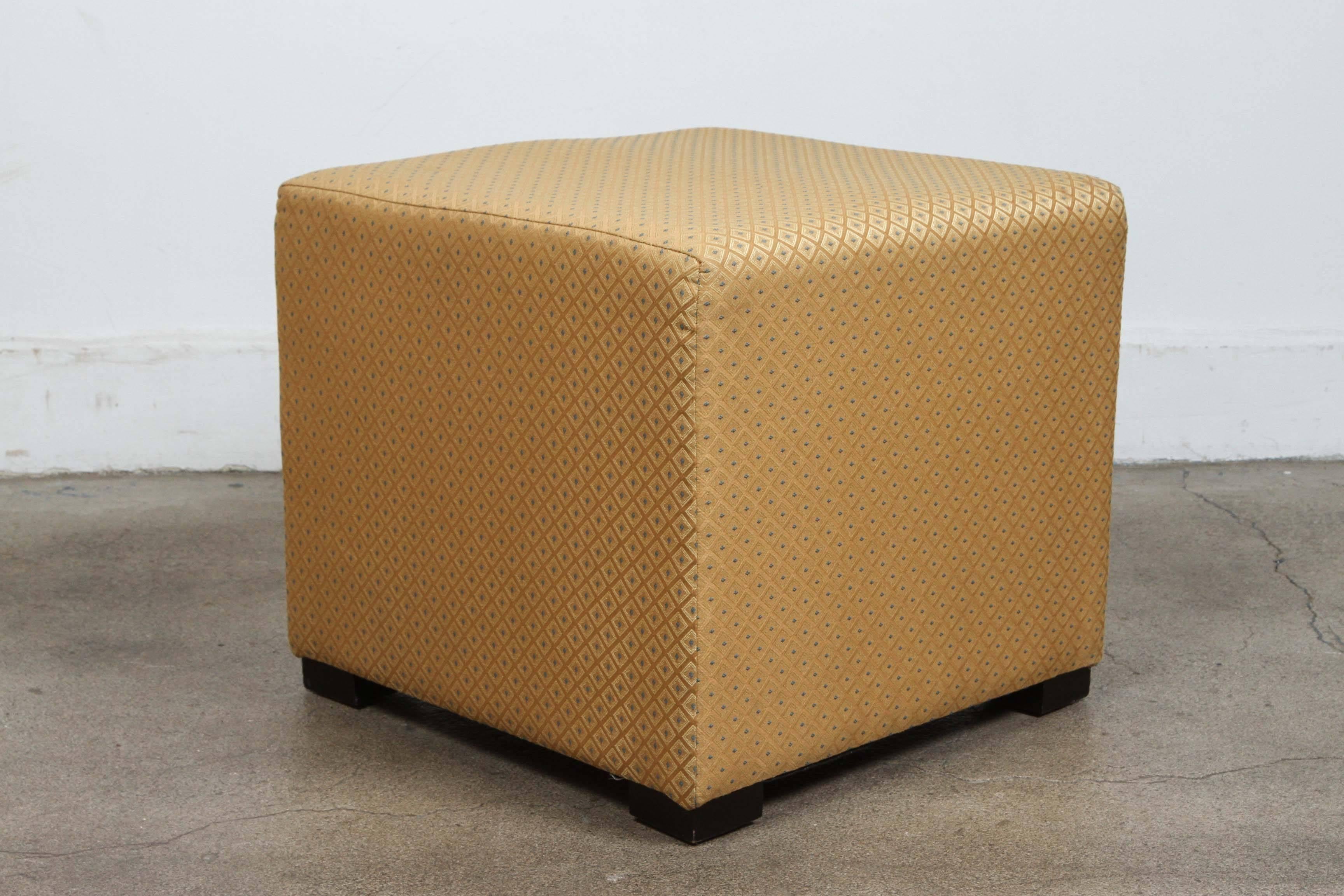 Pair of gold cube upholstery ottomans, Poufs.
Use them as extra seats, ottomans, stools.
Light and easy to move around.
Moroccan hassock, upholstered footstool or ottoman.
Fabric is textured Moroccan gold with light turquoise blue.
Pair of modern