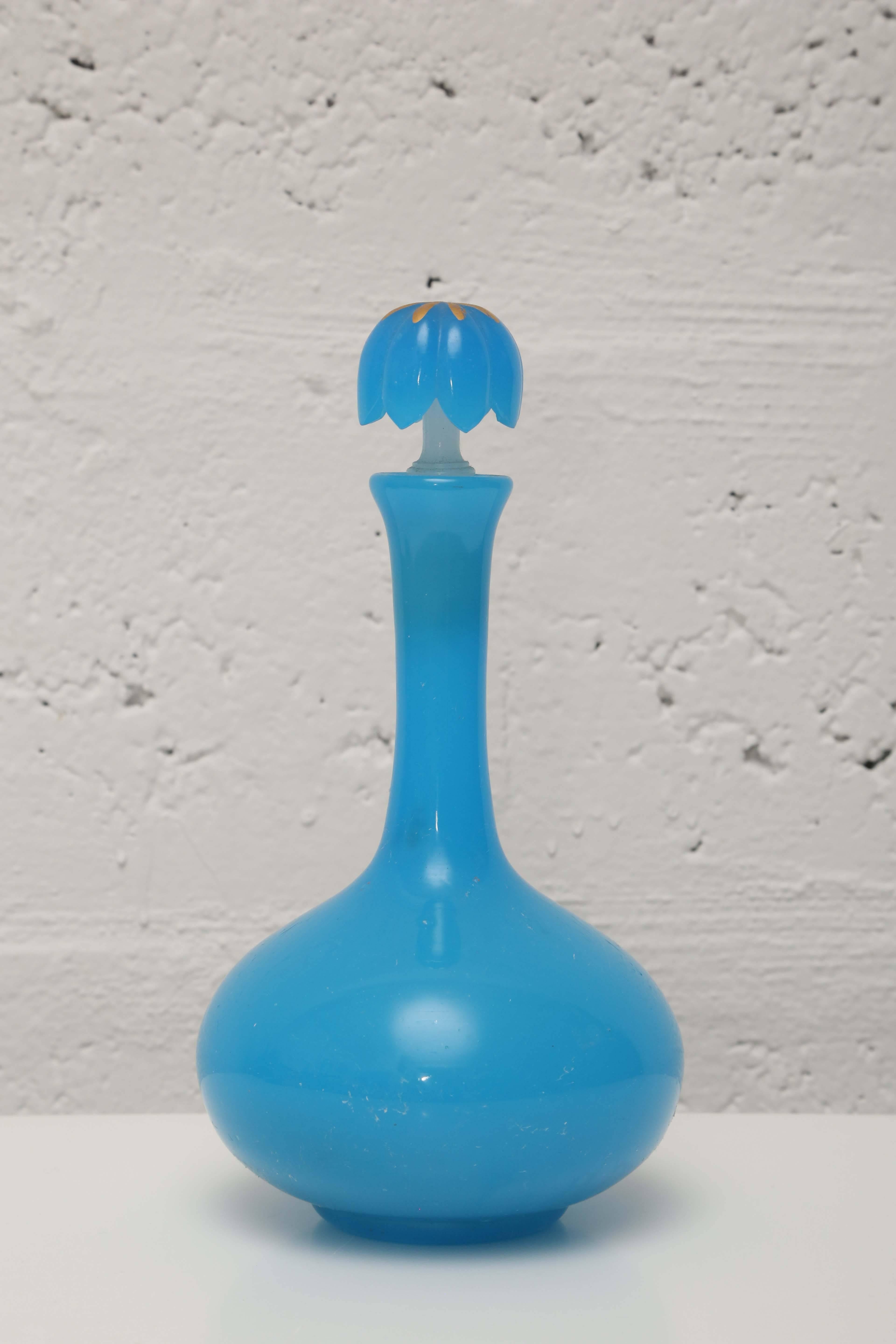 Gorgeous cornflower blue glass decanter with gold accents.