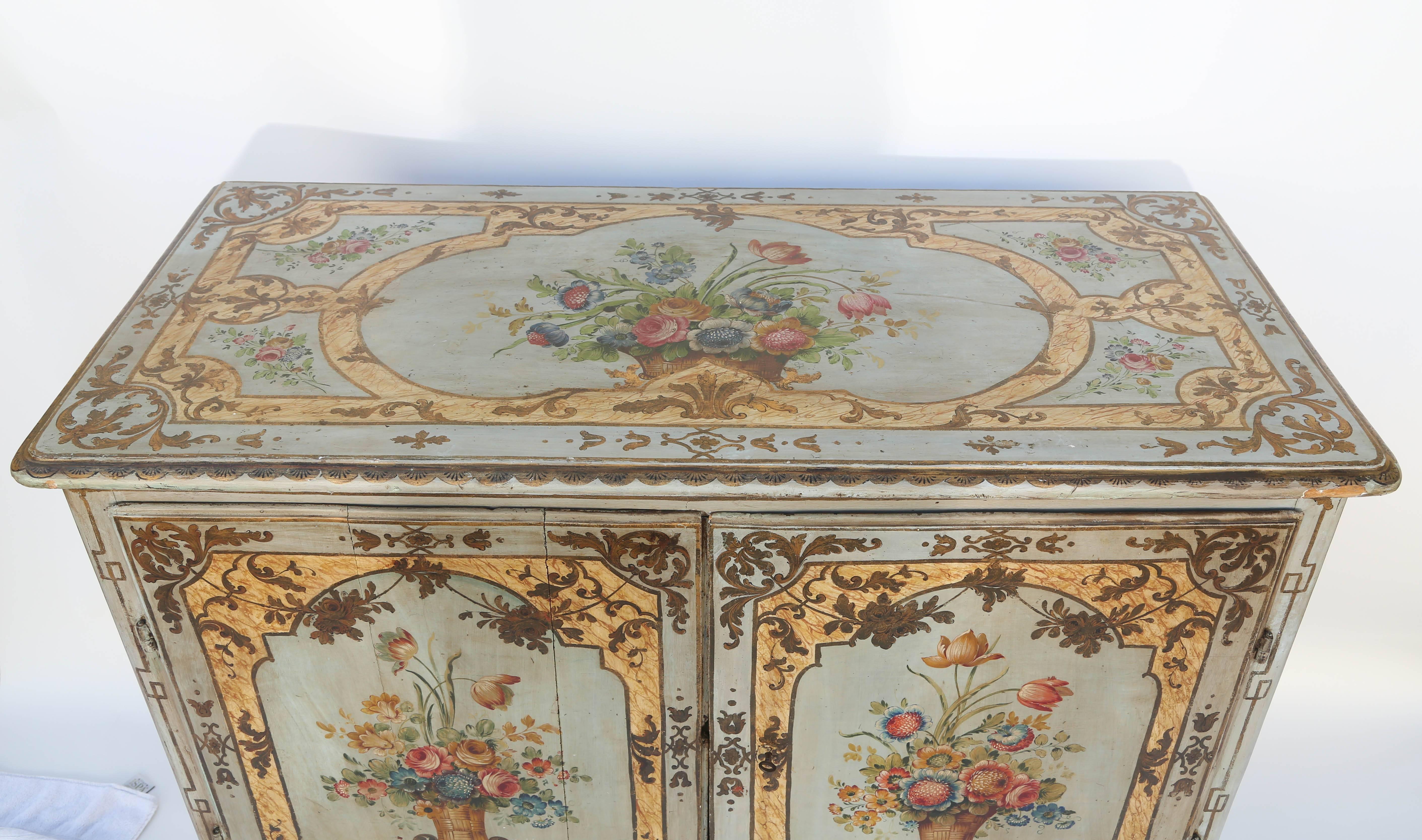 Exceptional 18th century, large-scale, two-door server, having a rectangular molded top over double cupboard doors, raised on tapering, square legs; exquisitely hand-painted in the late 19th century.

Stock ID: D9411