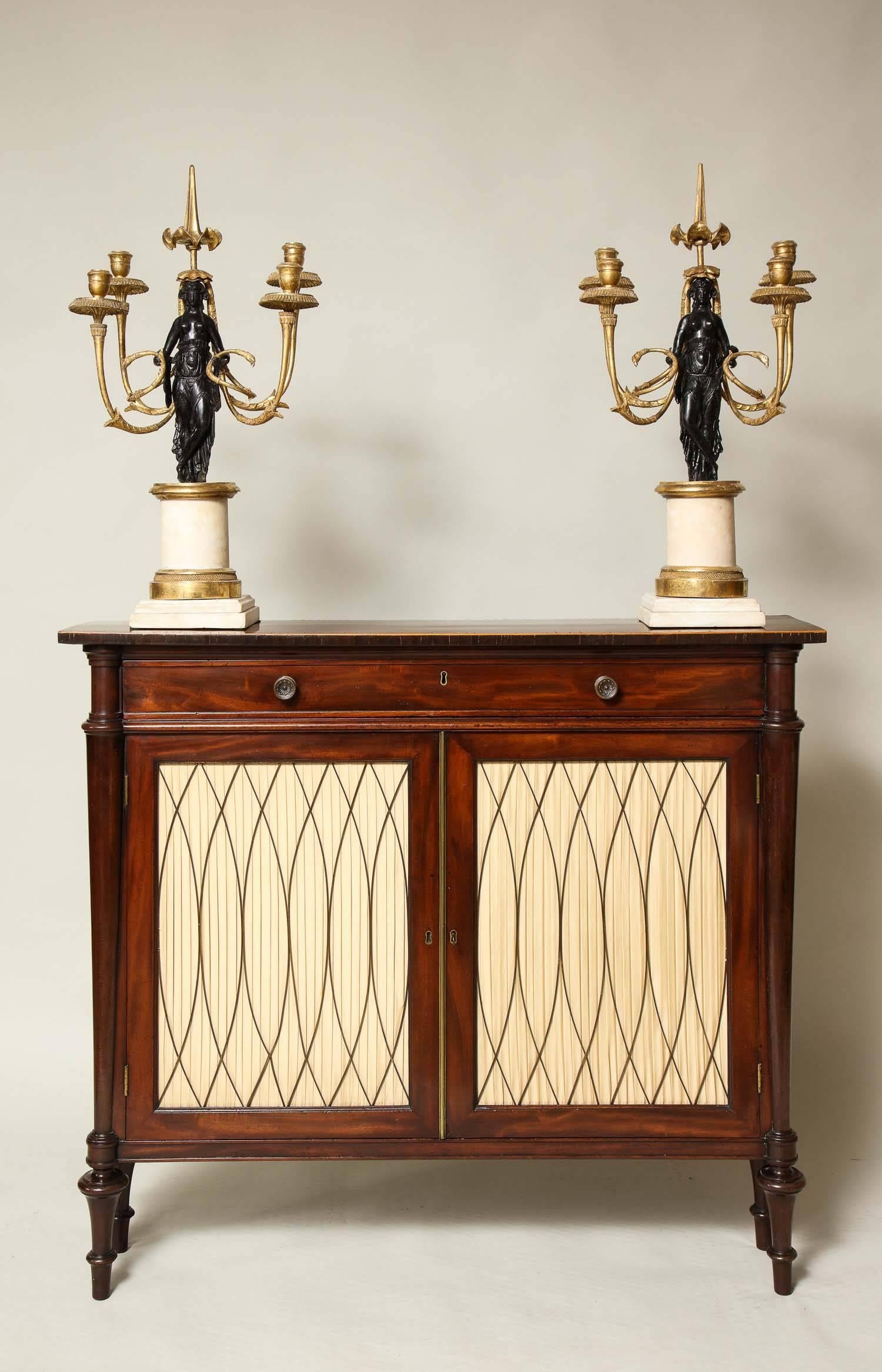 Fine and rare pair of English Regency period candelabra in carved giltwood, marble and composition, possibly by Humphrey Hopper, having classical figures standing on columnar plinths surrounded by swooping eagle-headed candelabra arms and surmounted