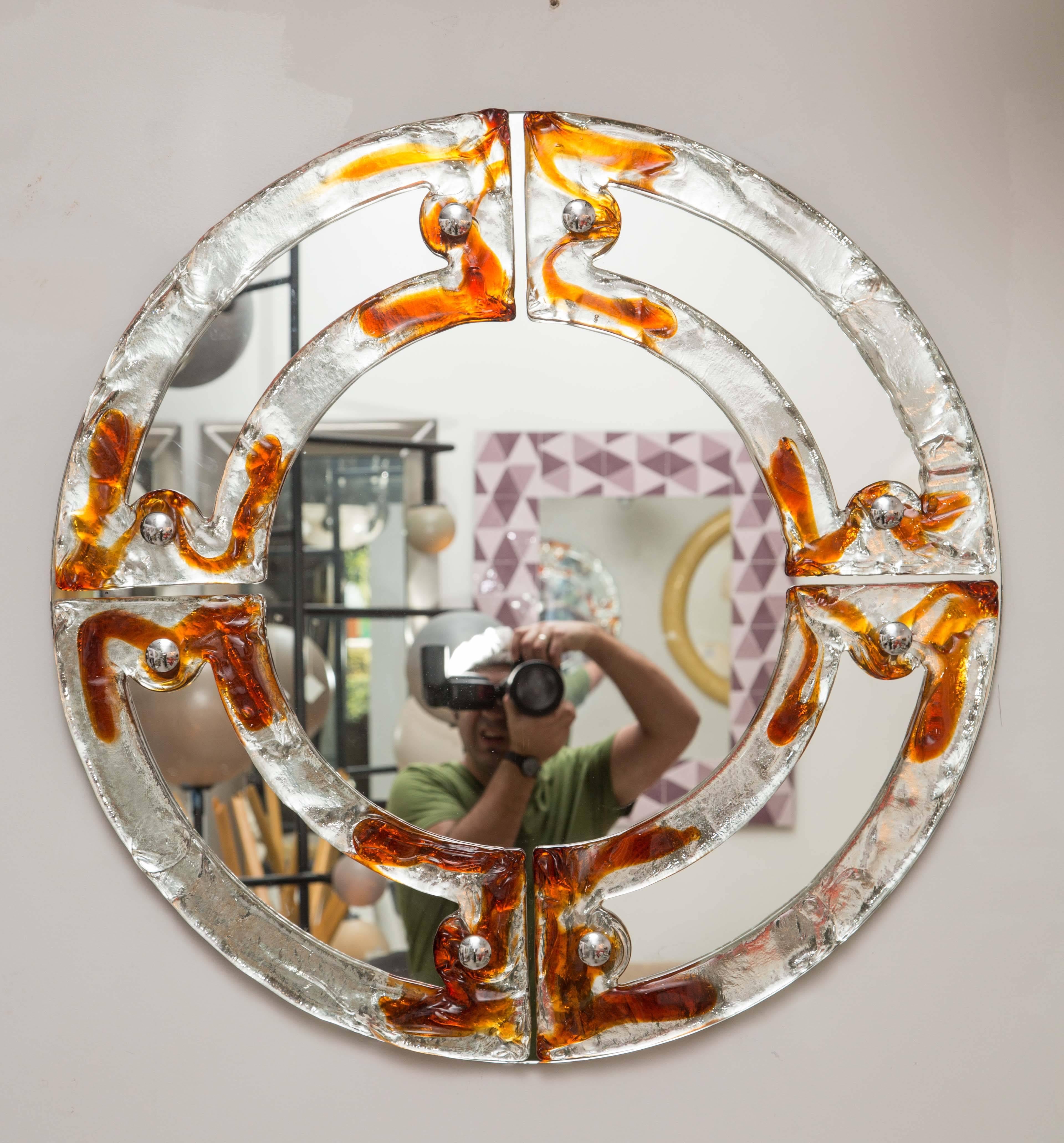 Two individually priced circular glass mirrors with amber and clear glass by Mazzega.