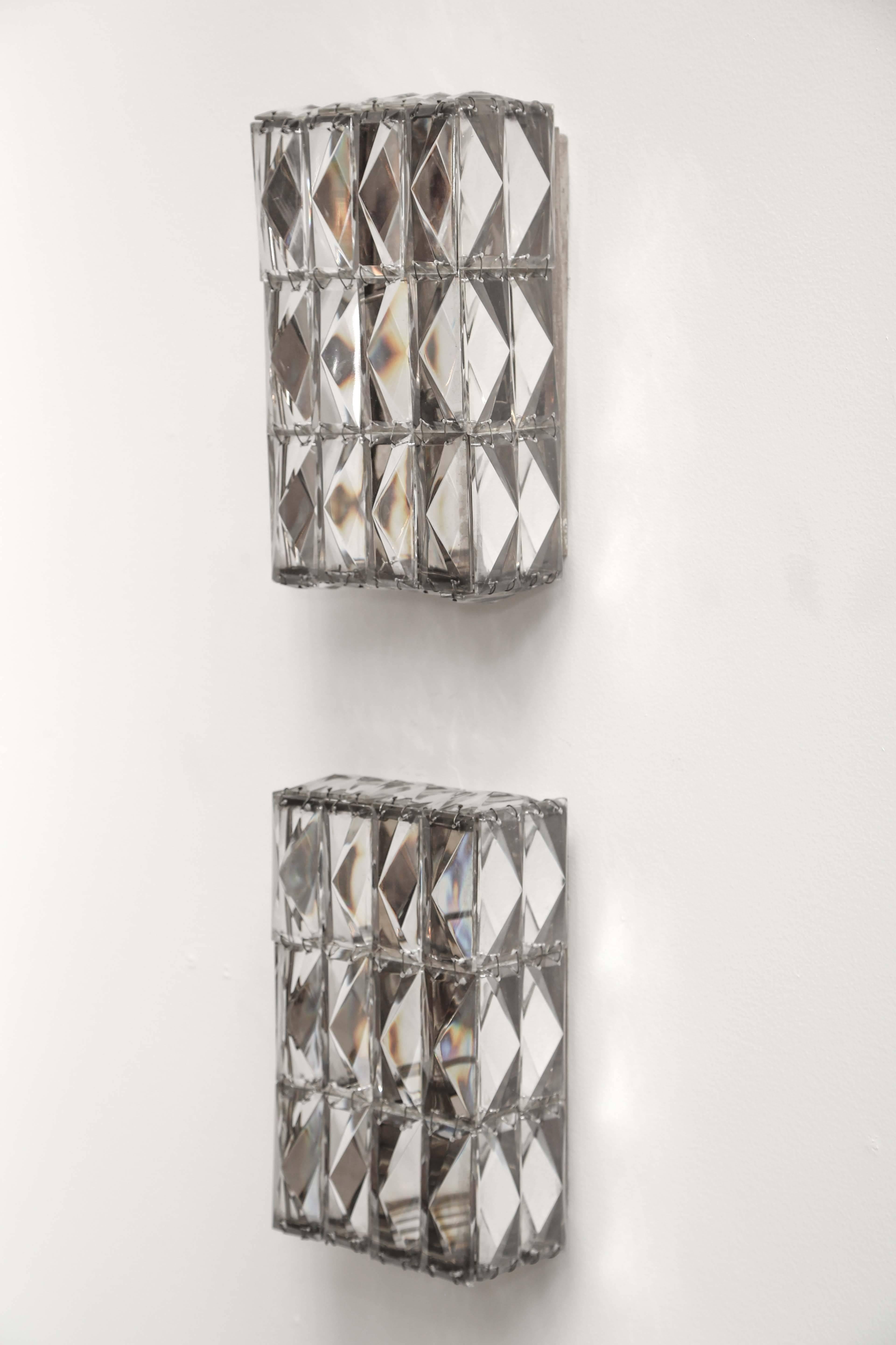 Pair of vintage faceted crystal sconces from Austria. The pair have been professionally rewired to US standards.