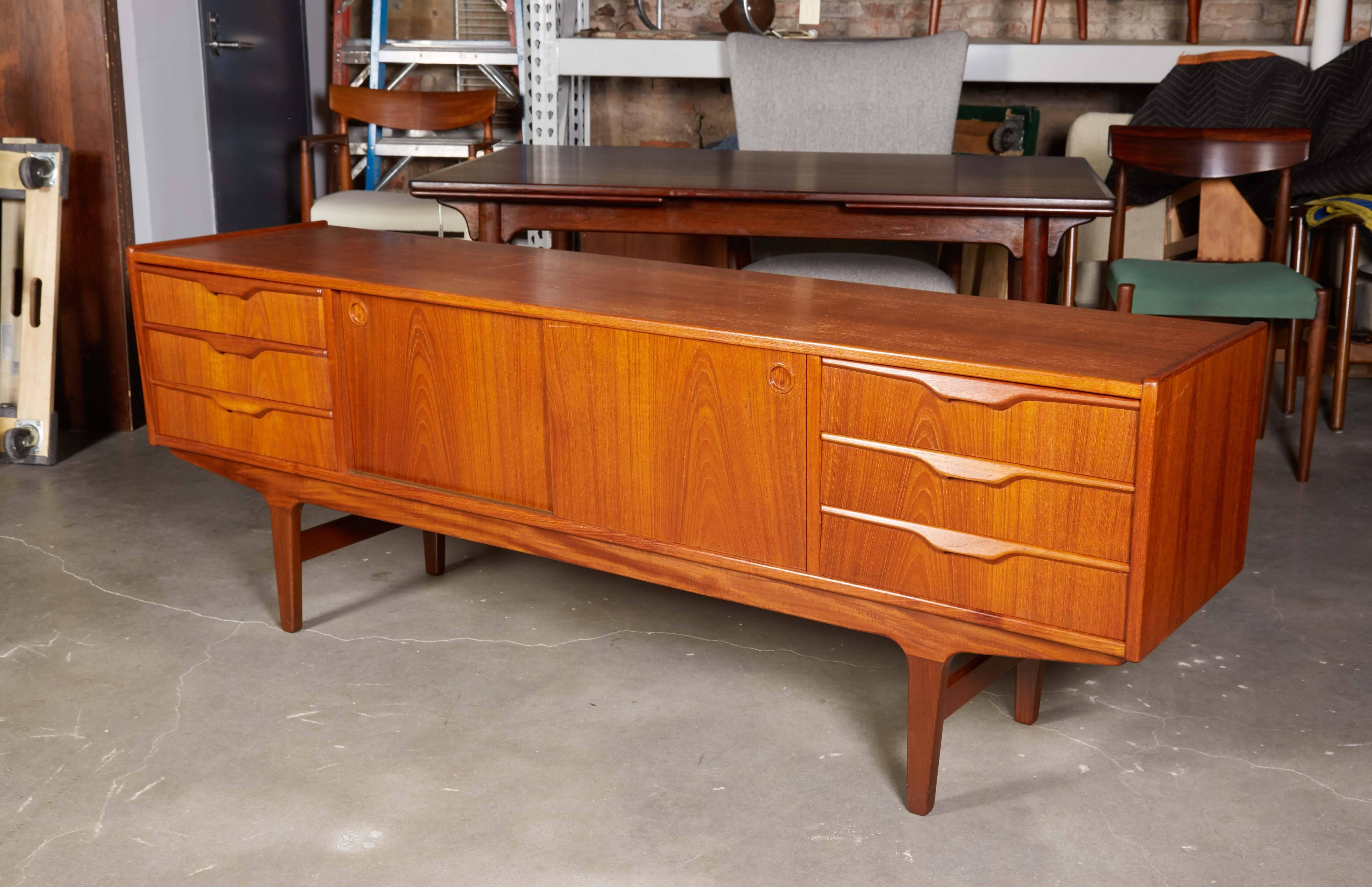 Mid Century 1960s Danish Sideboard

This vintage sideboard is in excellent condition. The height is rare from this period and the combination of sliding doors and drawers works well in any room where you need storage. Ready for pick up, delivery, or