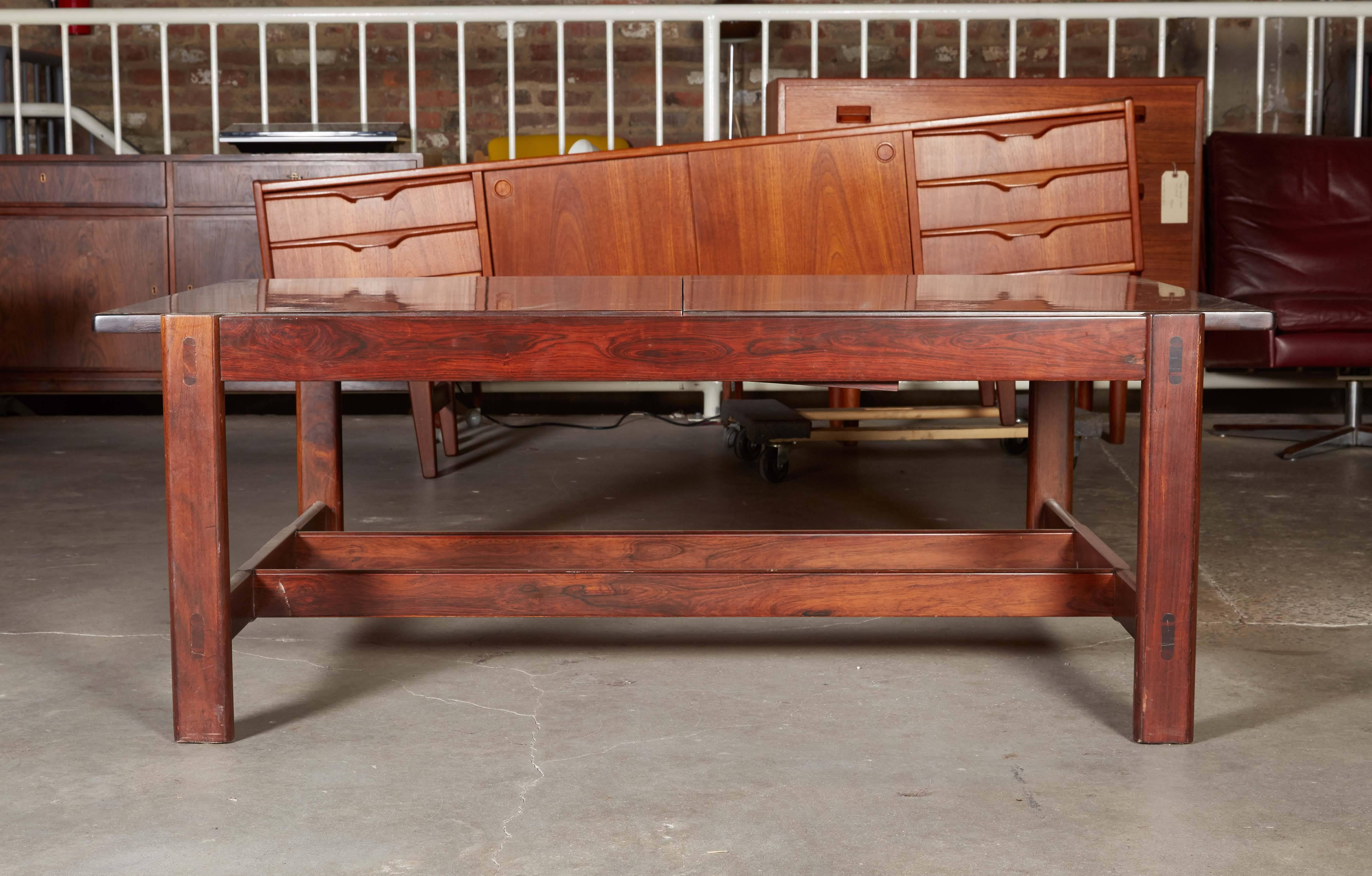 1960s Rosewood Coffee Table by Torbjorn Afdal

This vintage coffee table expands. This has a swing leaf made with laminate giving you a built in coaster, maybe a card table, or when you have guests because it just allows for more serving space. Easy