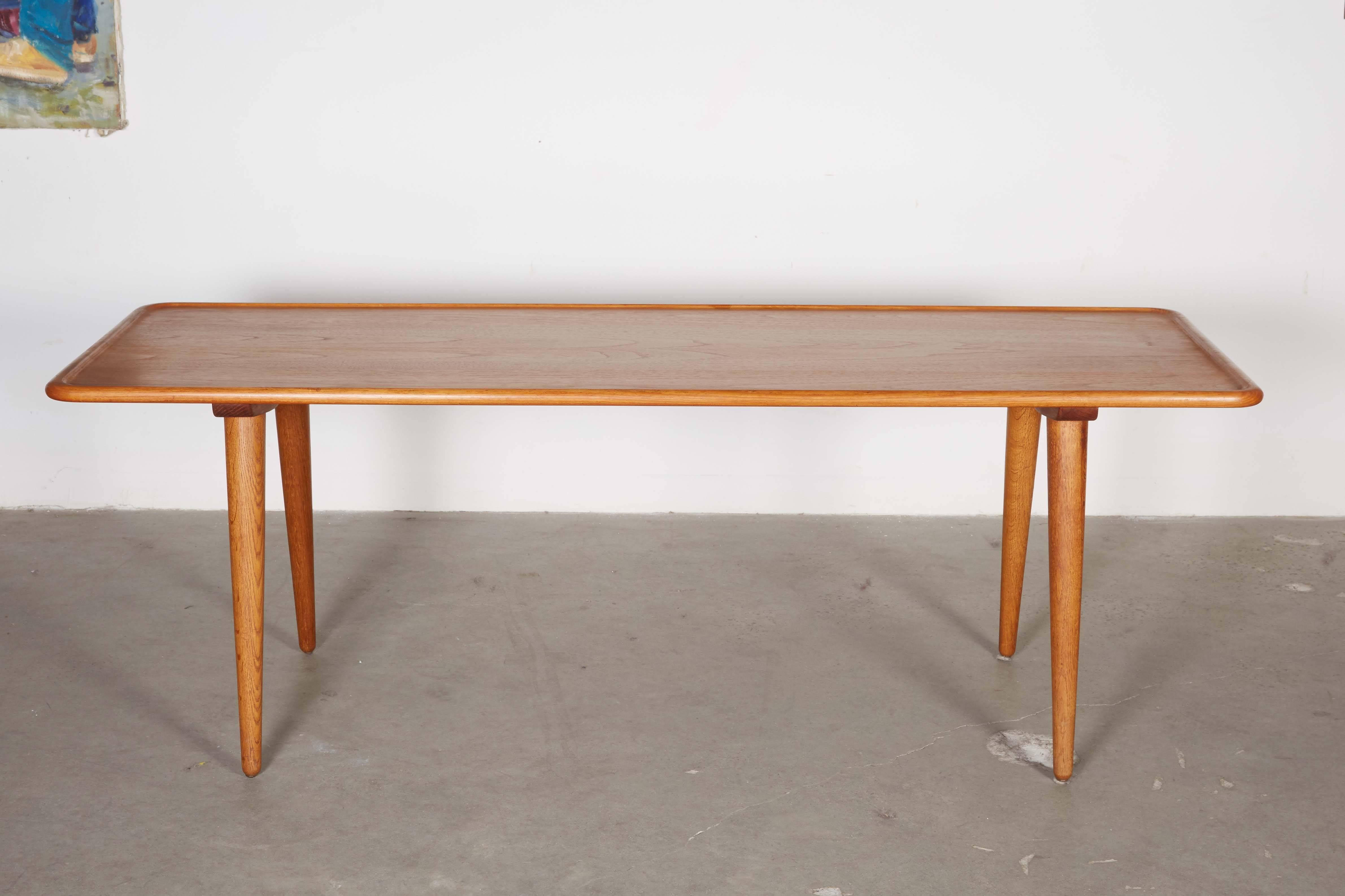 Mid Century 1950s Hans Wegner Coffee Table

This teak coffee table is in excellent condition. In traditional Wegner style, the legs are oak and the top is teak. Ready for pick up, delivery, or shipping anywhere in the world. 