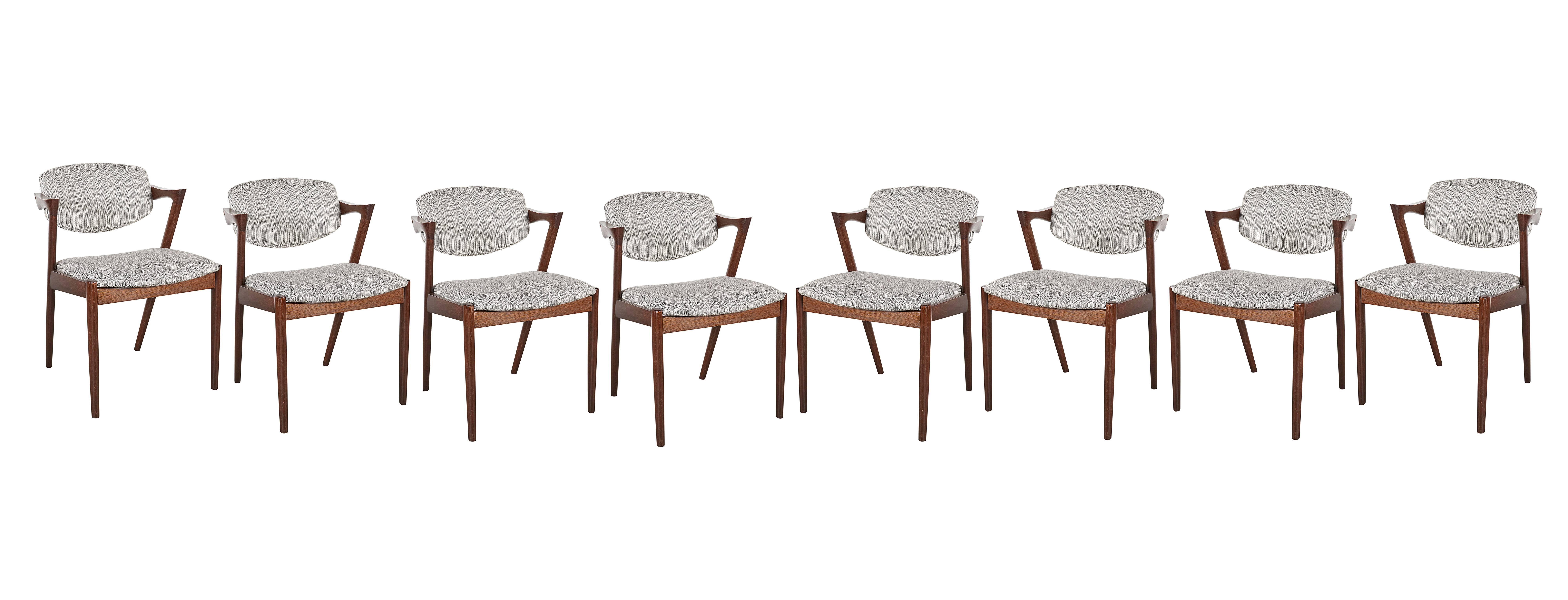 Mid Century 1950s Dining Chairs by Kai Kristiansen

These vintage teak dining chairs are in excellent condition and stained in wenge, a rare find. Beautiful shape, and still the most comfortable dining chair you will ever sit in. Newly upholstered