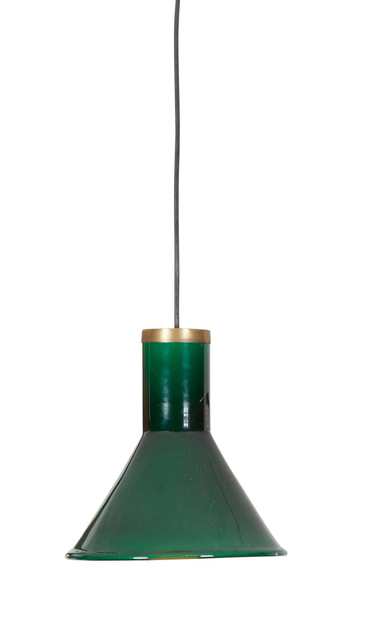 Mid Century Glass Ceiling Lamps

This green pendant lamp is in excellent condition. The color is rich and the top covers are brass. Wattage is as much as you can handle if an LED bulb is used, but 60 watts with a regular incandescent bulb. Ready for
