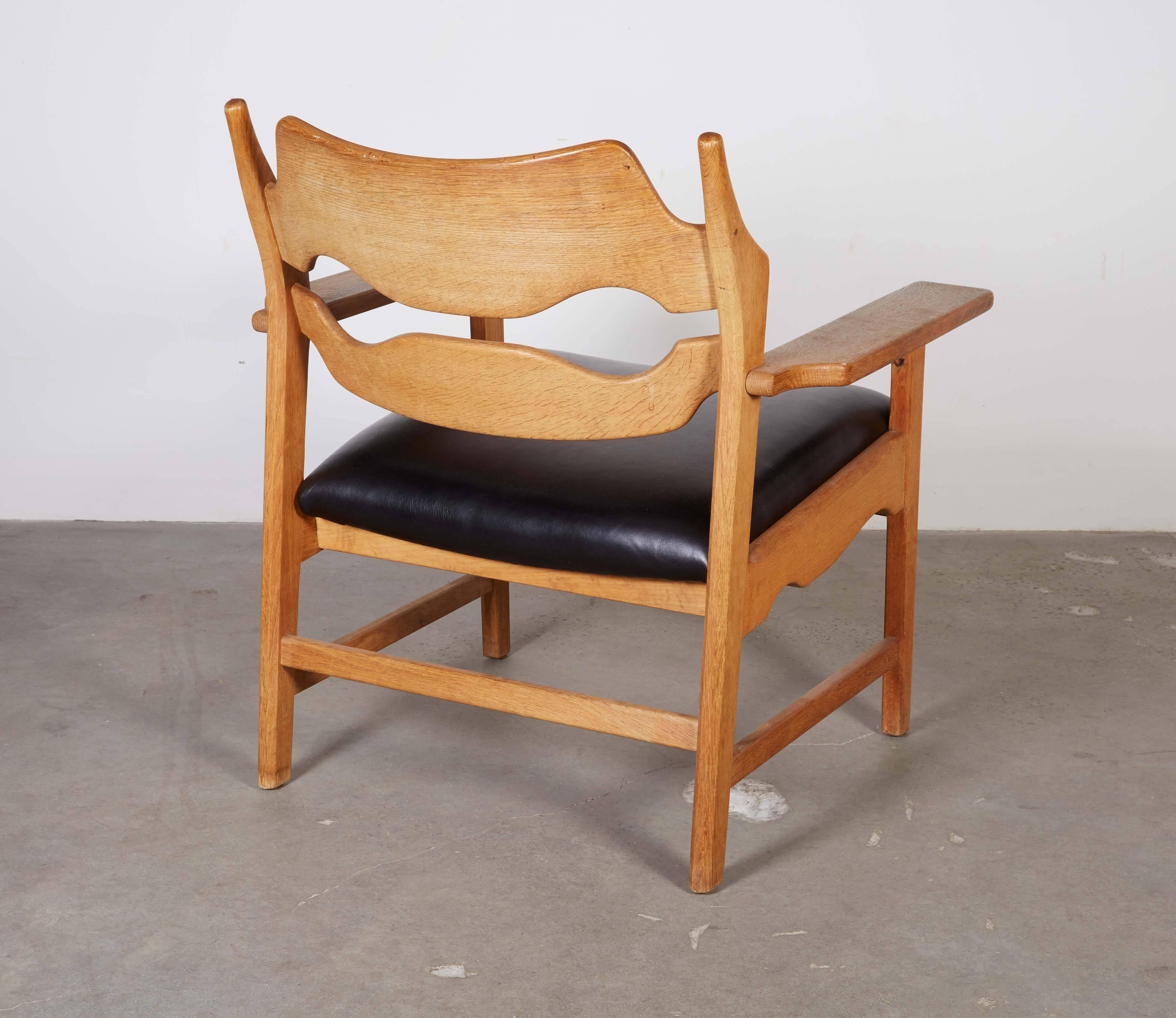 Leather Danish Armchairs by Henning Kjaernulf in Oak For Sale