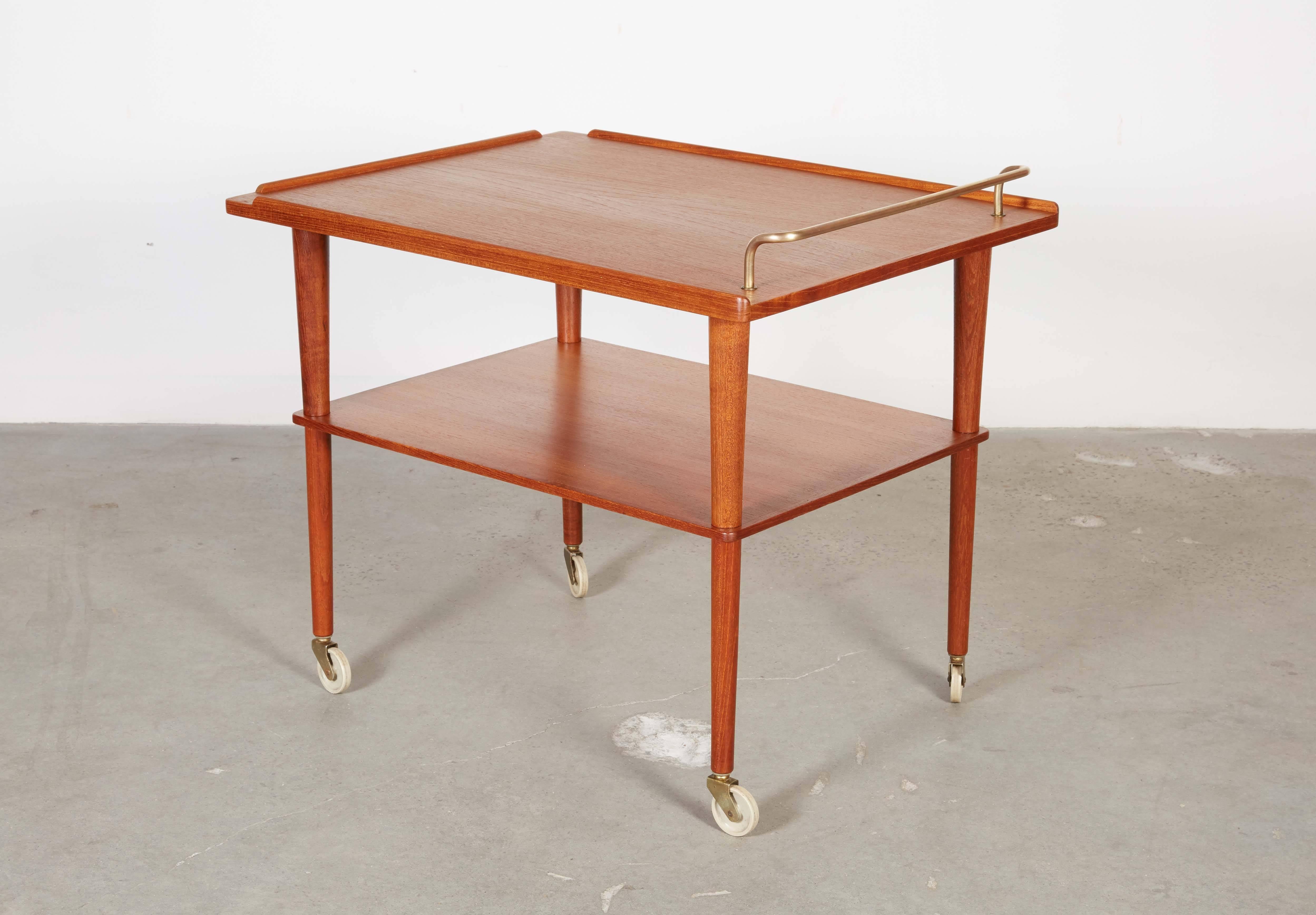Vinage 1960s A. Hovman Olsen Teak Bar Cart

This Danish Bar Cart is in excellent condition. Liquor access is great in any room. Just wheel is over. Ready for pick up, delivery, or shipping anywhere in the world. 