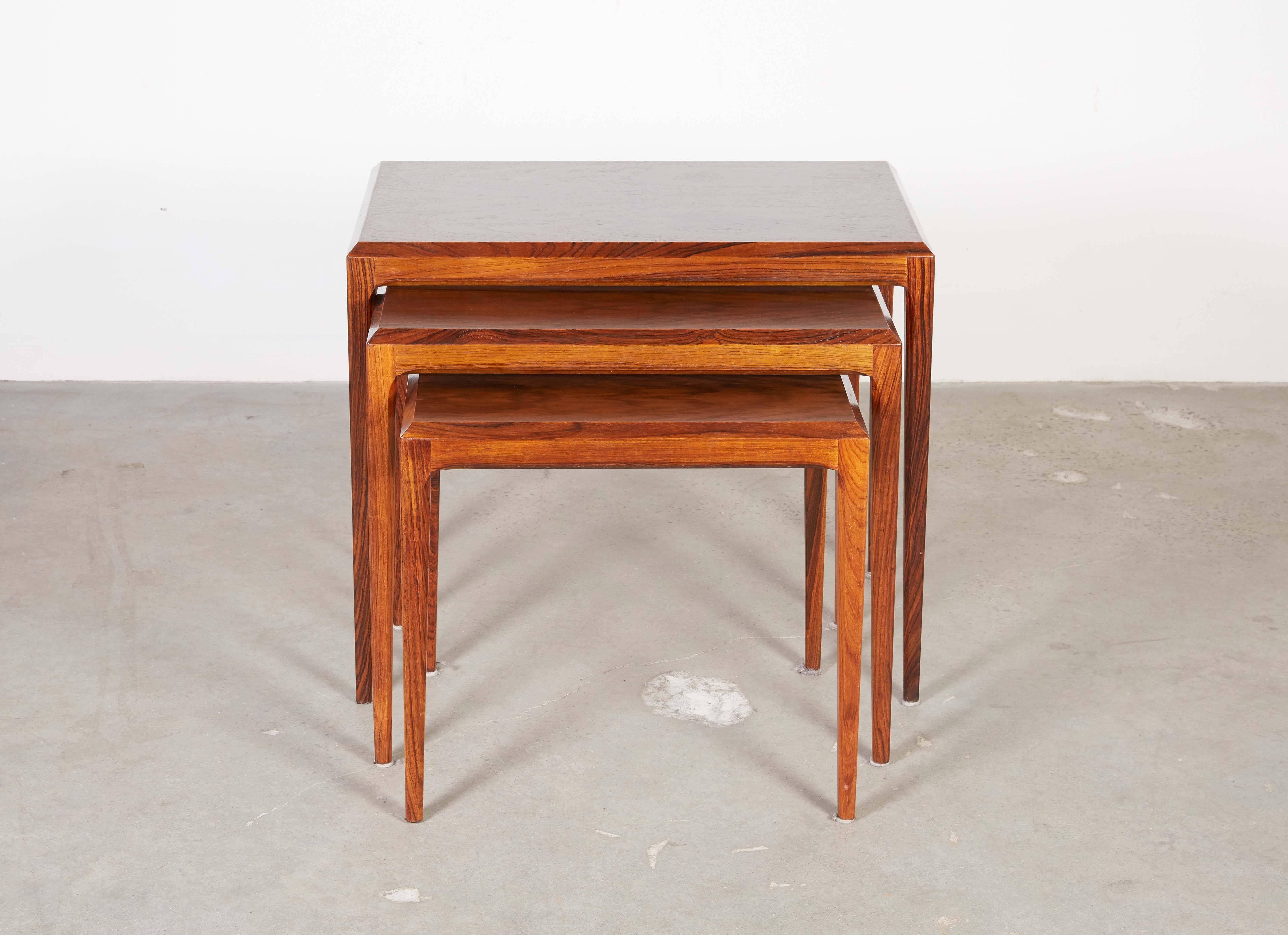 Mid Century 1960s Stacking Tables in Rosewood

These Danish nesting tables are in excellent condition. Use them in any room you need a little more table space. Use them as a night stand or as an extension for your desk, and of coarse beautiful as a