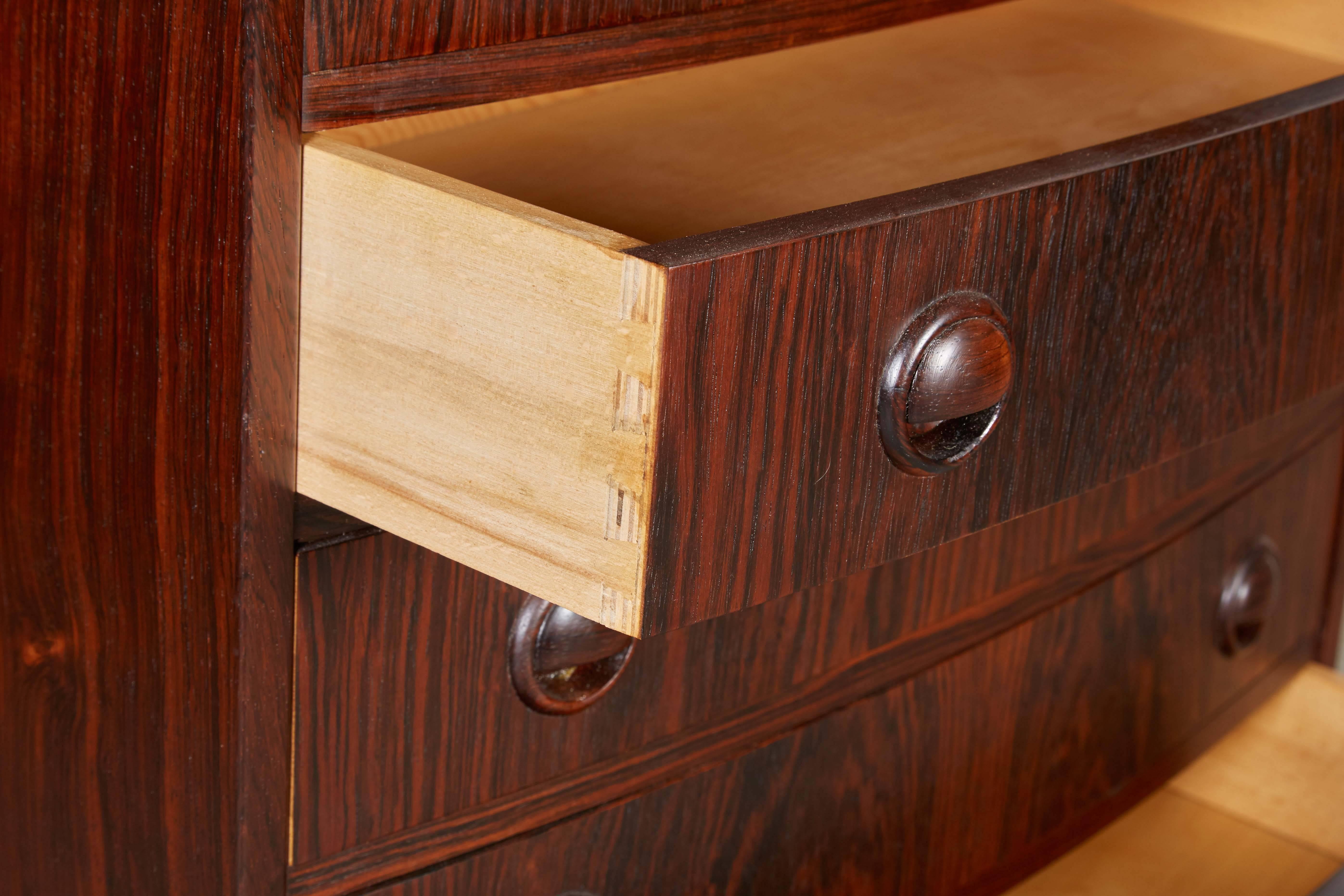 Mid Century 1960s Small Dresser

This vintage chest of drawers is excellent condition. Goes great in a bedroom, living room, or anywhere you need storage. Beech dovetailed drawers are used for the most competent structure. Built to last forever.