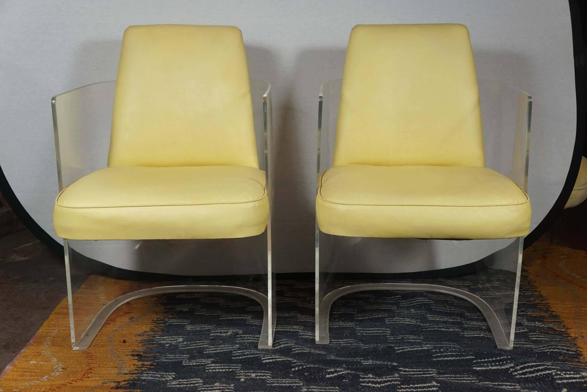These custom-designed chairs by Vladimir Kagan, circa 1960 are in their original upholstery. Plexiglass with lemon colored vinyl in one of Kagan's most iconic and preferred designs. Incredibly comfortable or functional as well as chic.