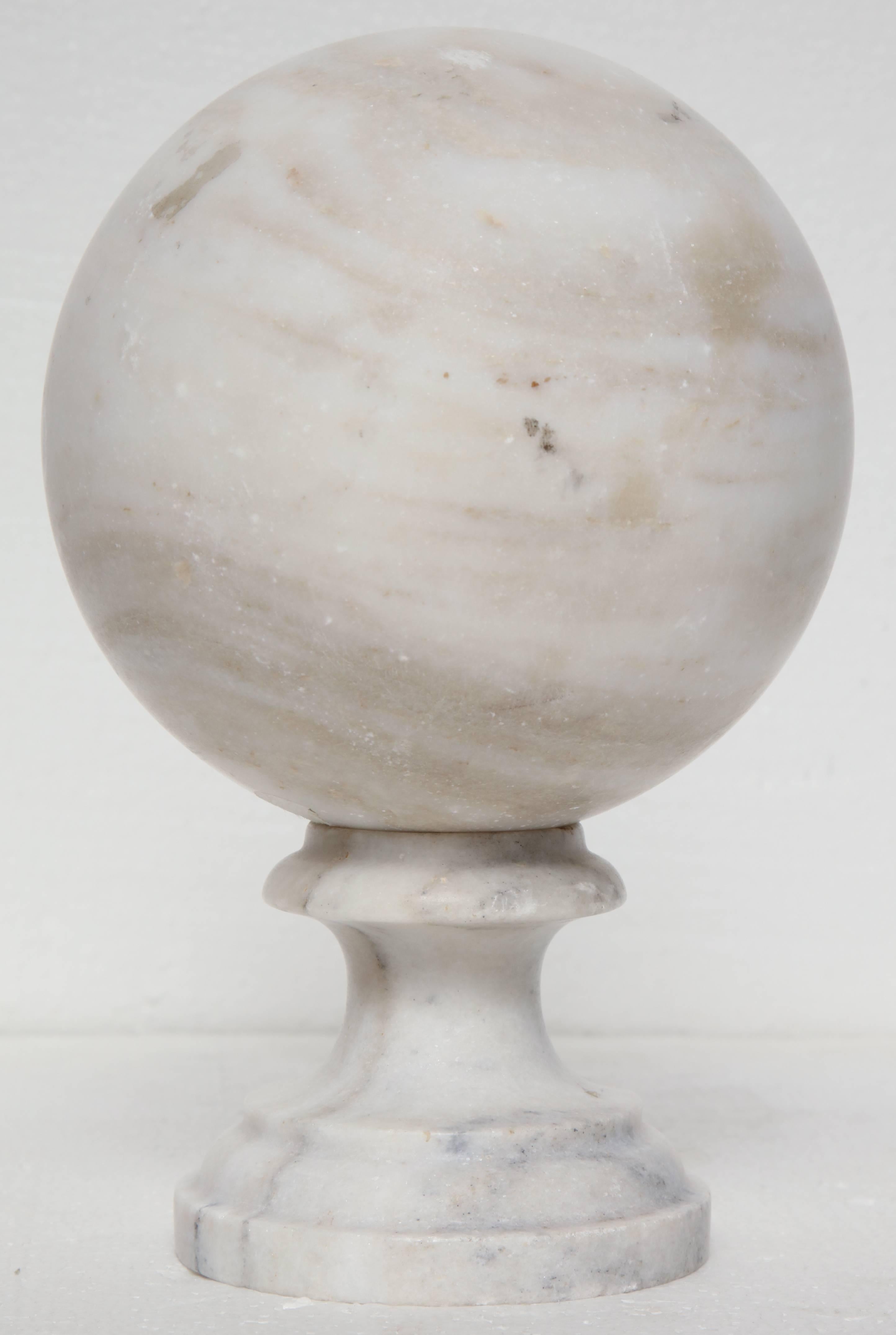 Single marble ball on stand.