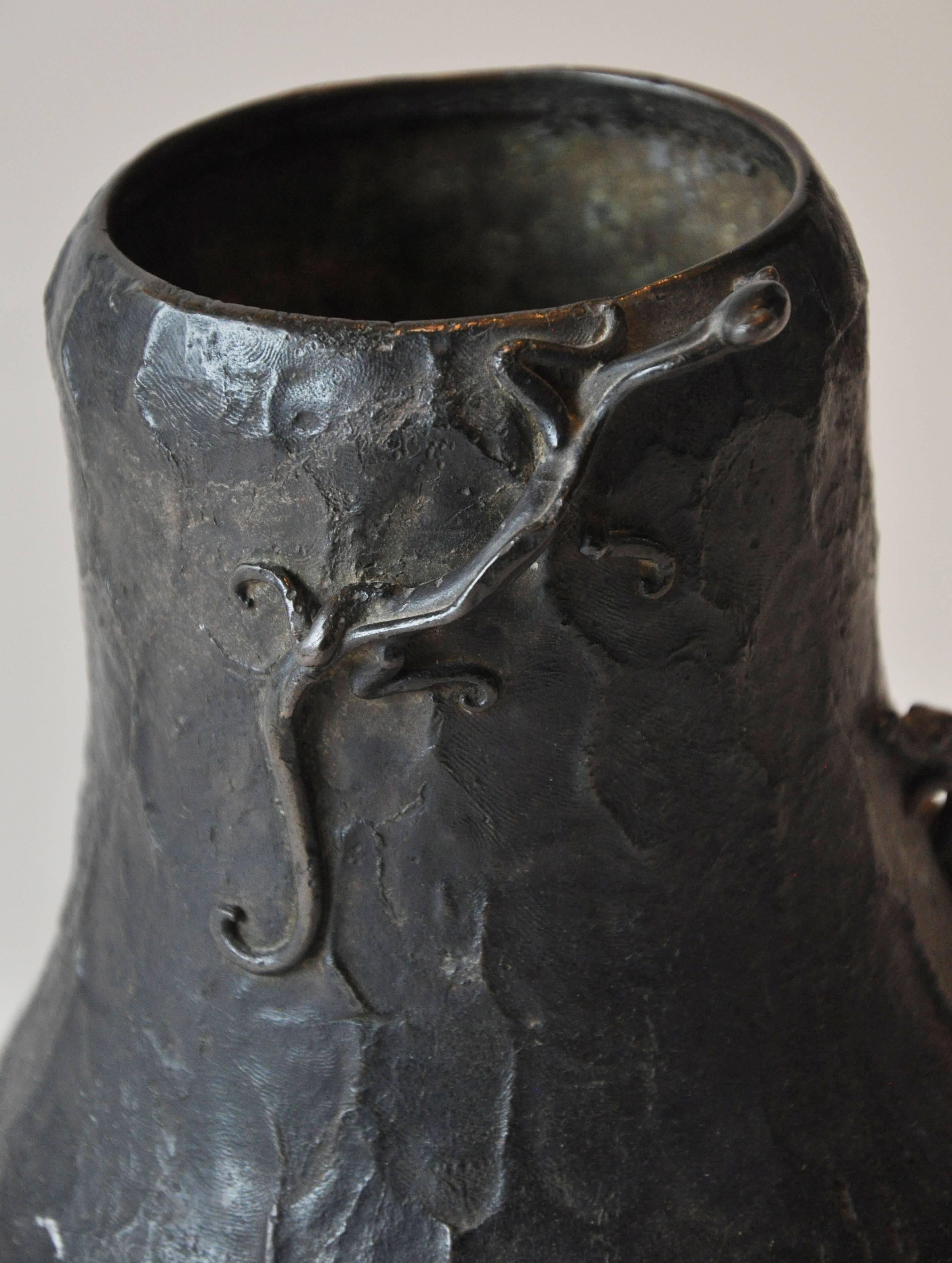 Late 18th century German bronze vase with two stylized scaling dragons. Blackened finish.

 