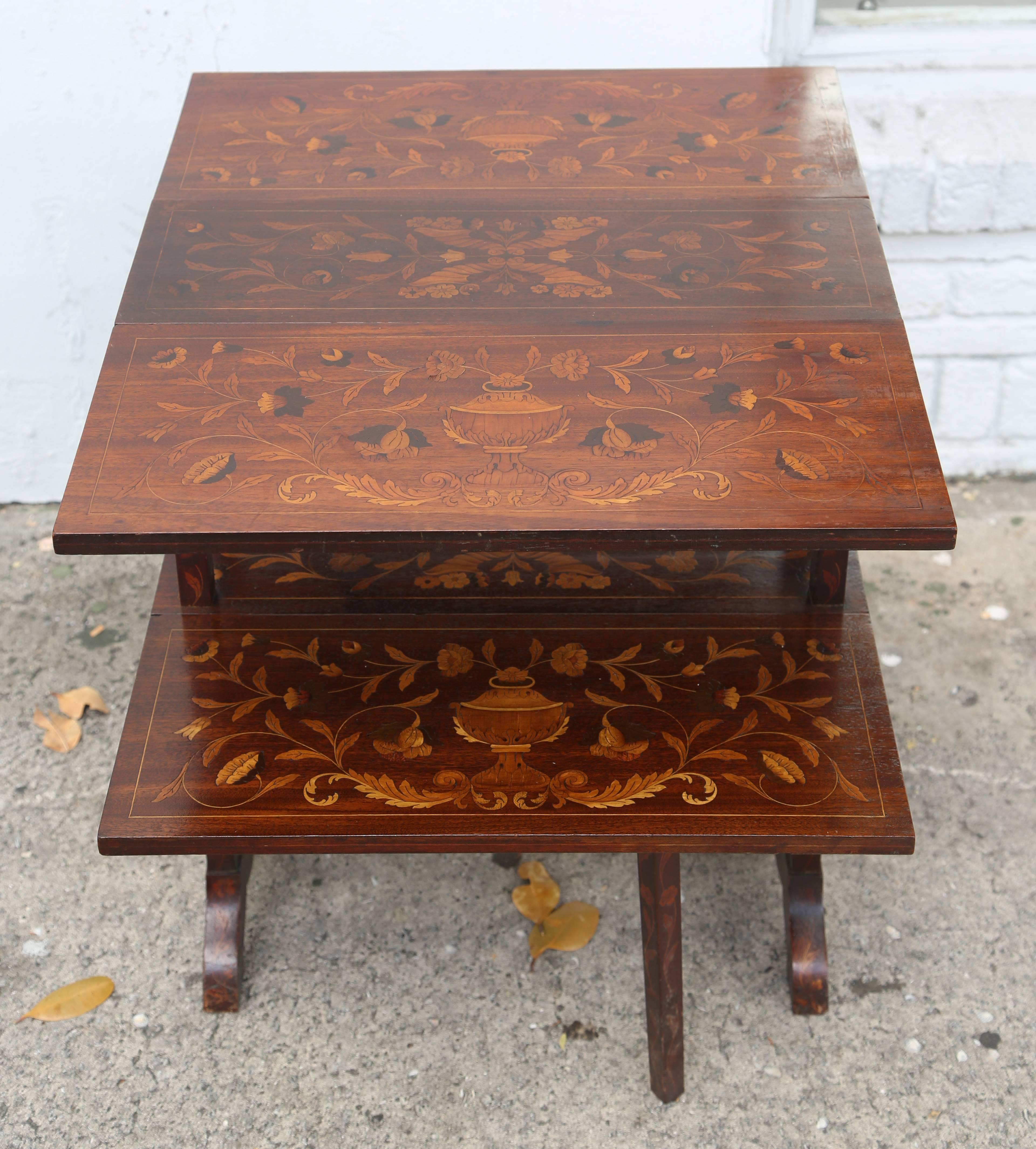 This is a very unusual and rare drop-leaf table, made in England, circa 1870.
Measures: 26 high x 26 wide x 33 long with the leafs up and 10 inches across with the leafs down. Two drop leafs to each side, then folds away to a small table.
 