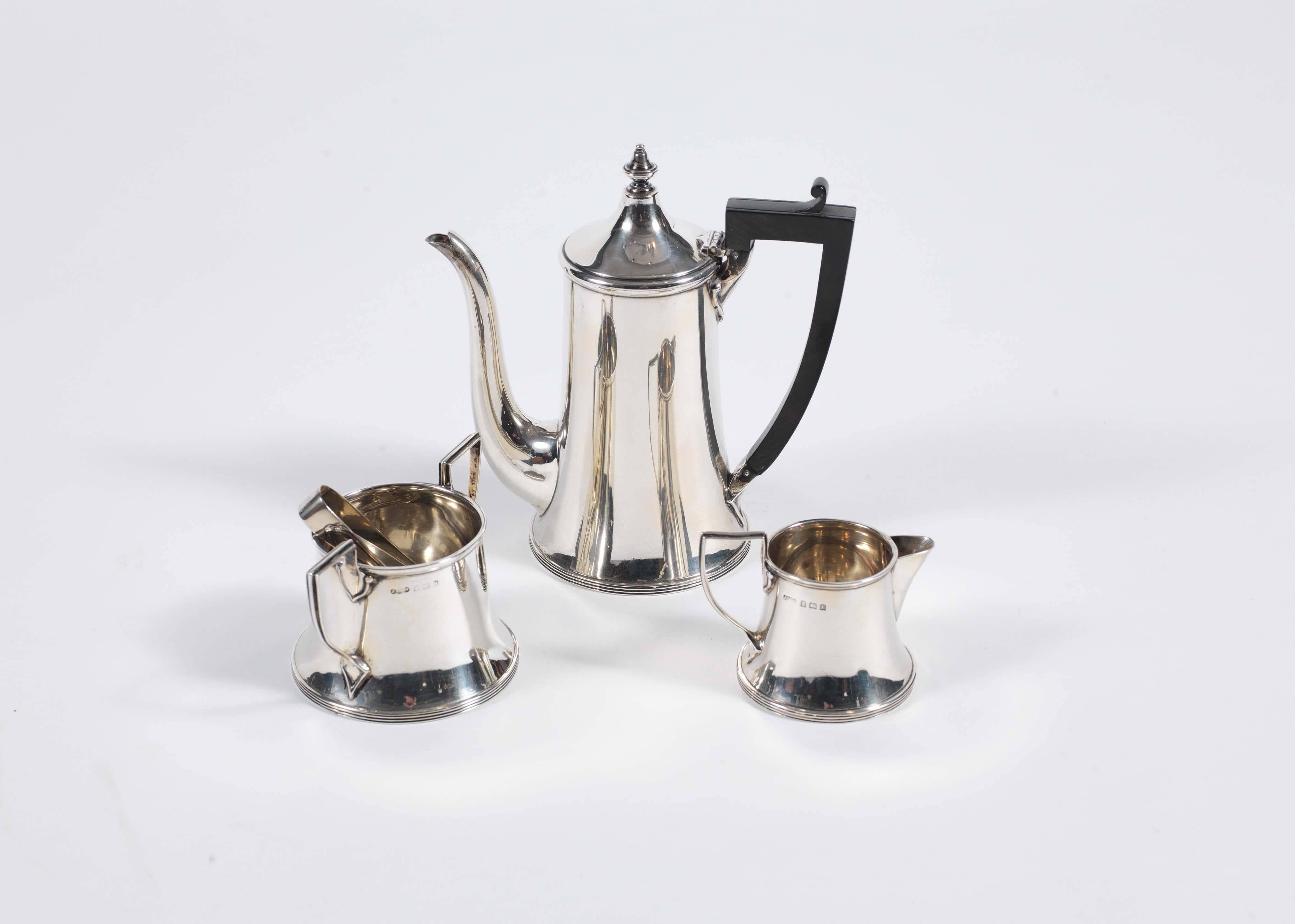 Extremely elegant, the coffee pot and sugar bowl hallmarked for Birmingham, silver, 1926 by J Collyer Ltd., the jug 1929. In the classical style and of fabulous scale.