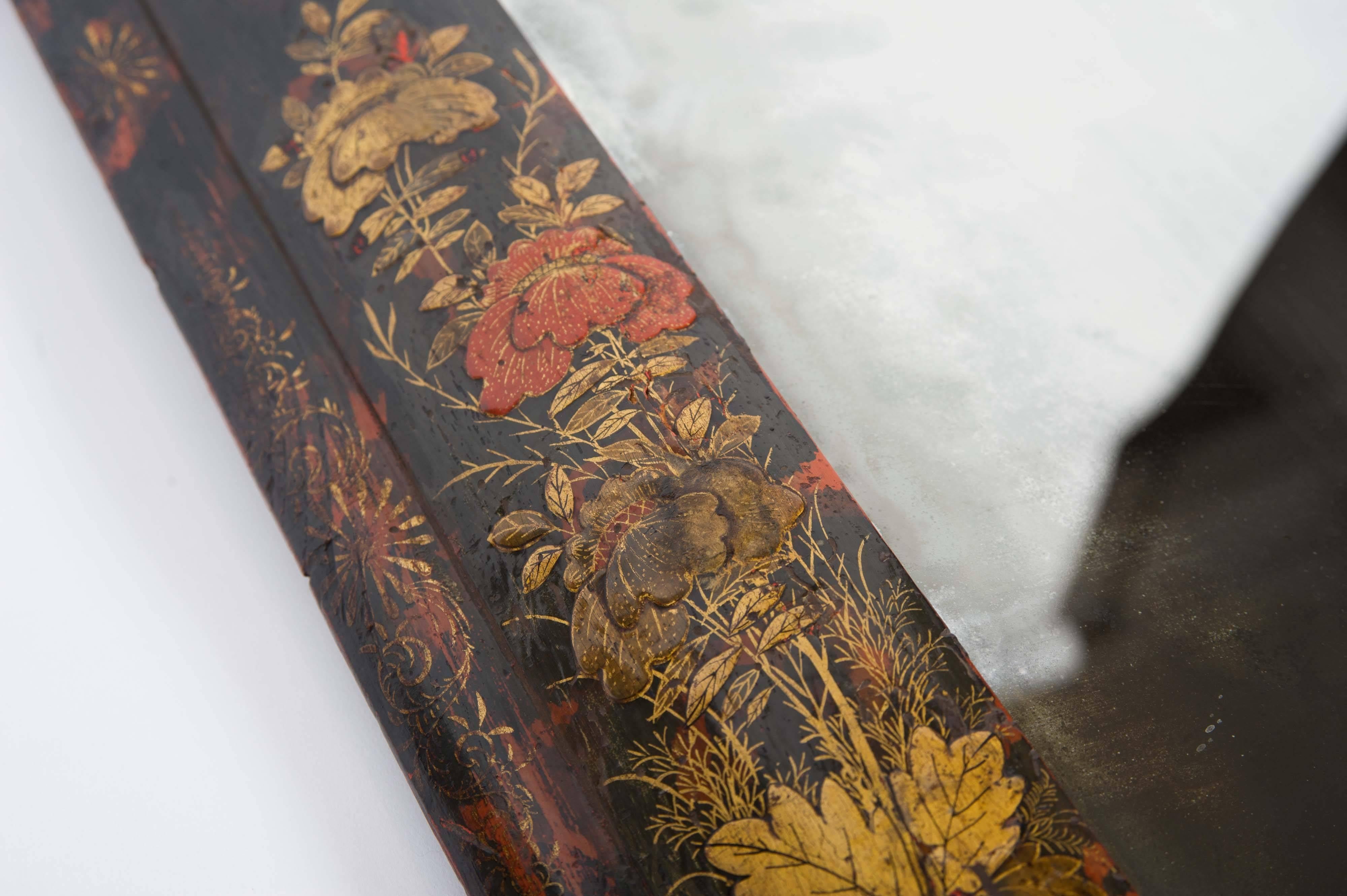 The lacquer frame with black, red and gilt decoration in the chinoiserie taste.
An inventory label on the reverse of 