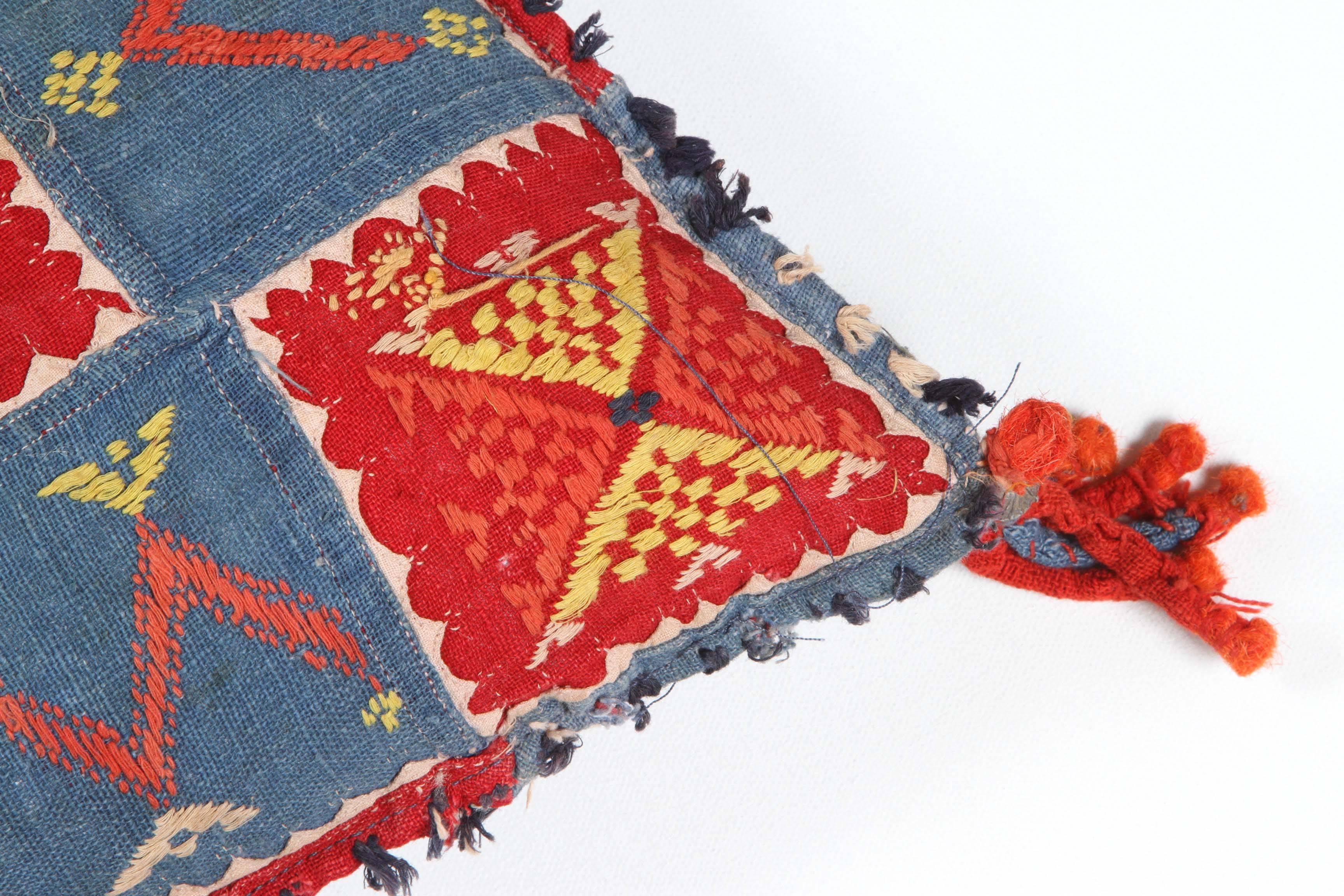 Vintage North Indian cotton textile pillow or cushion. Embroidery, patchwork and applique. Original tassels. Blue linen back, zipper enclosure, feather and down fill.