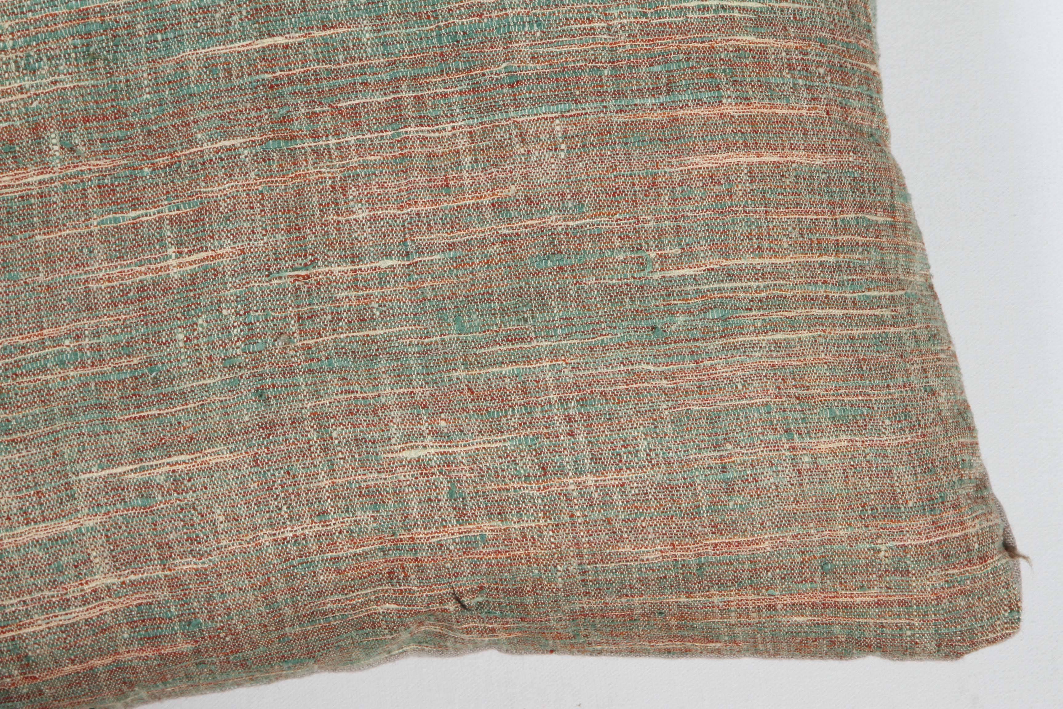 Contemporary Khadi cotton and silk hand woven fabric inspired by Gandhi and the Indian Independence Movement. Still made today and sold in Khadi shops all around India. This green and neutral colored pillow has a natural linen back, invisible zipper