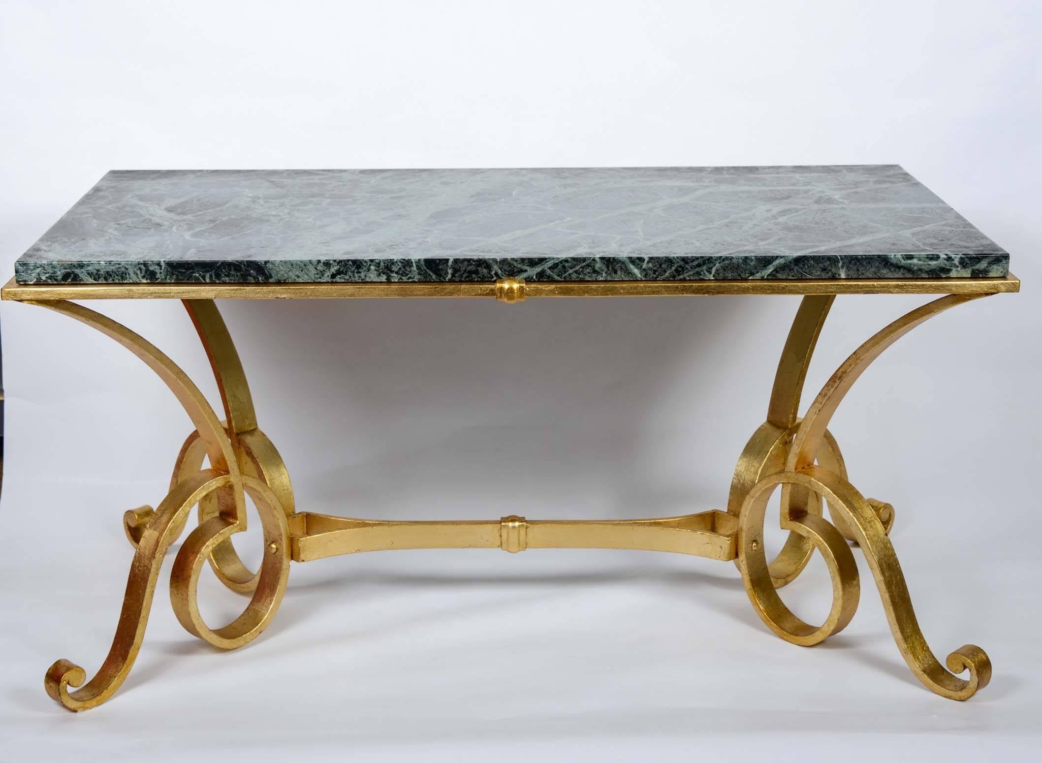 Coffee table in gold wrought iron and marble.