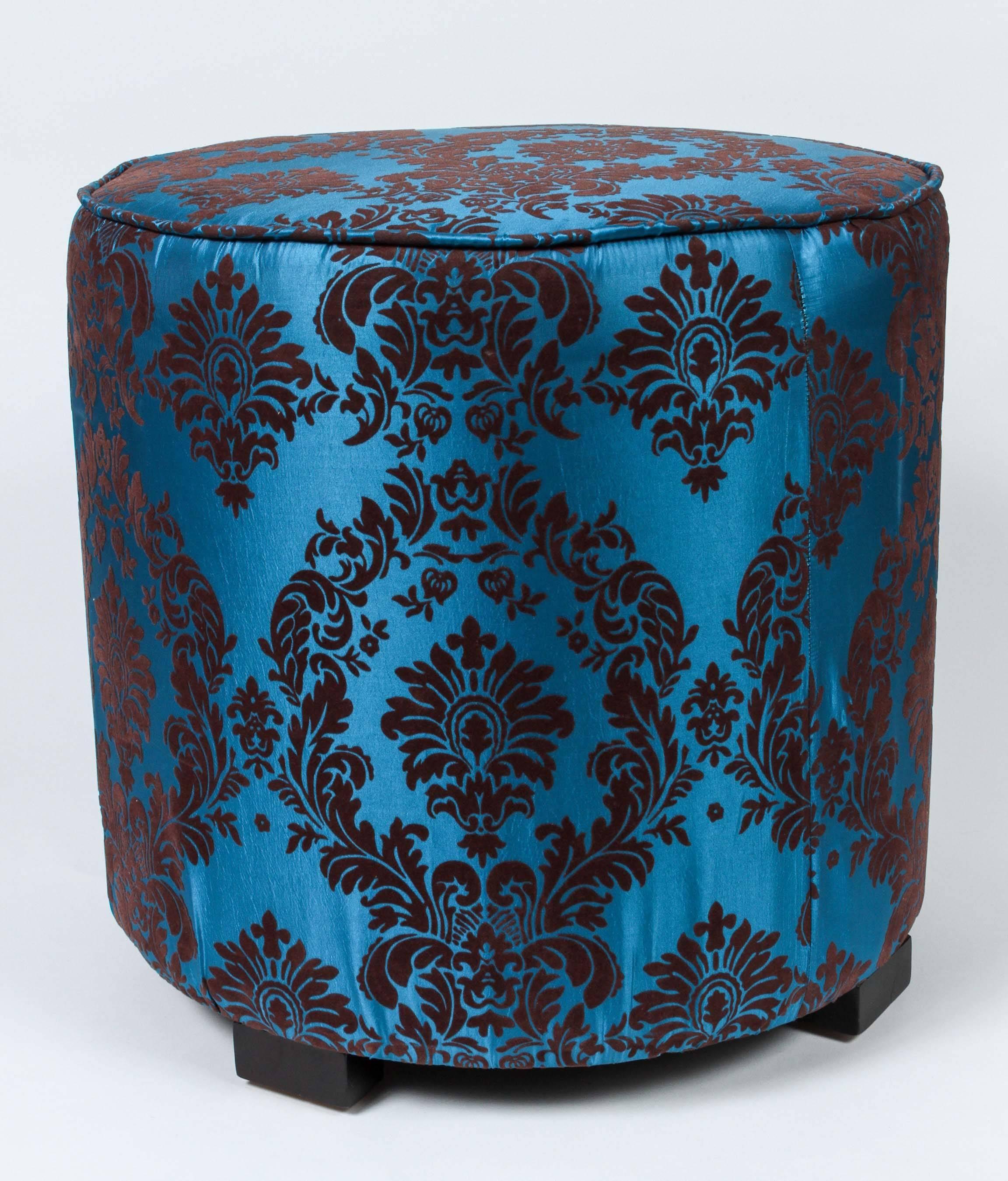 Pair of modern Contemporary round Moroccan style stool in blue and brown fabric upholstery in 1970s style.
Moroccan little pouf hassock, upholstered footstool or modern circular ottoman.
This versatile accent piece, pouf is designed primarily for