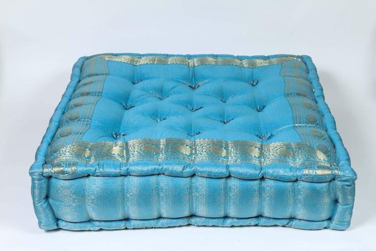 Oversized silk square turquoise and silver tufted floor seat yoga pillow.
Hand-crafted from silk sari fabric, these floor seat cushions are great to use in kids room or around your yoga Bohemian or Moroccan room or for your pet.
Mah Jong style