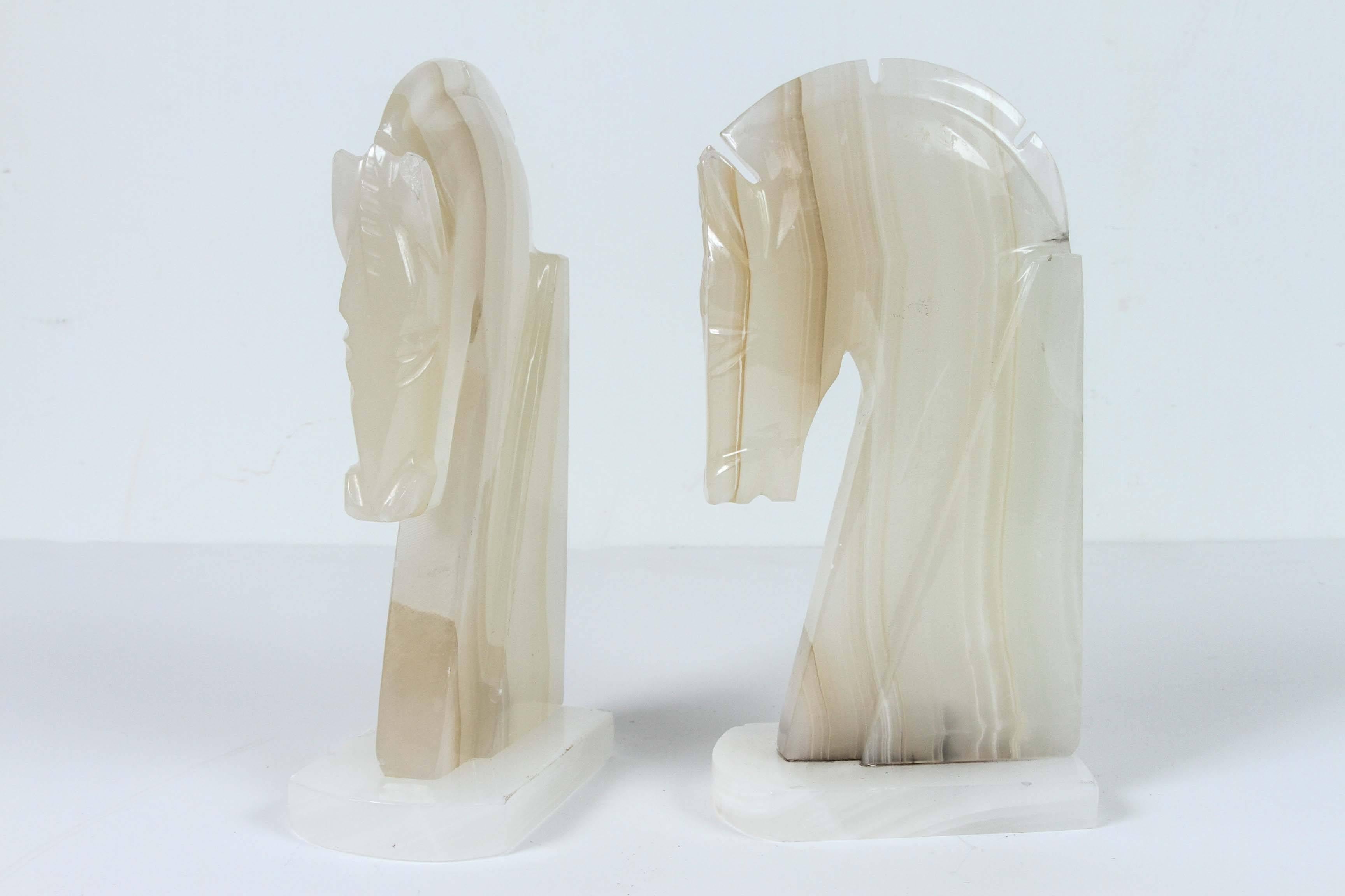 Pair of Art Deco style stylized horses head bookends.
Vintage set of bookends, hand-carved in marble in a shade of light ivory and browns.
Hermes style horses, great modern design.
Measures: Each horse head measure 9" x 2"5 x