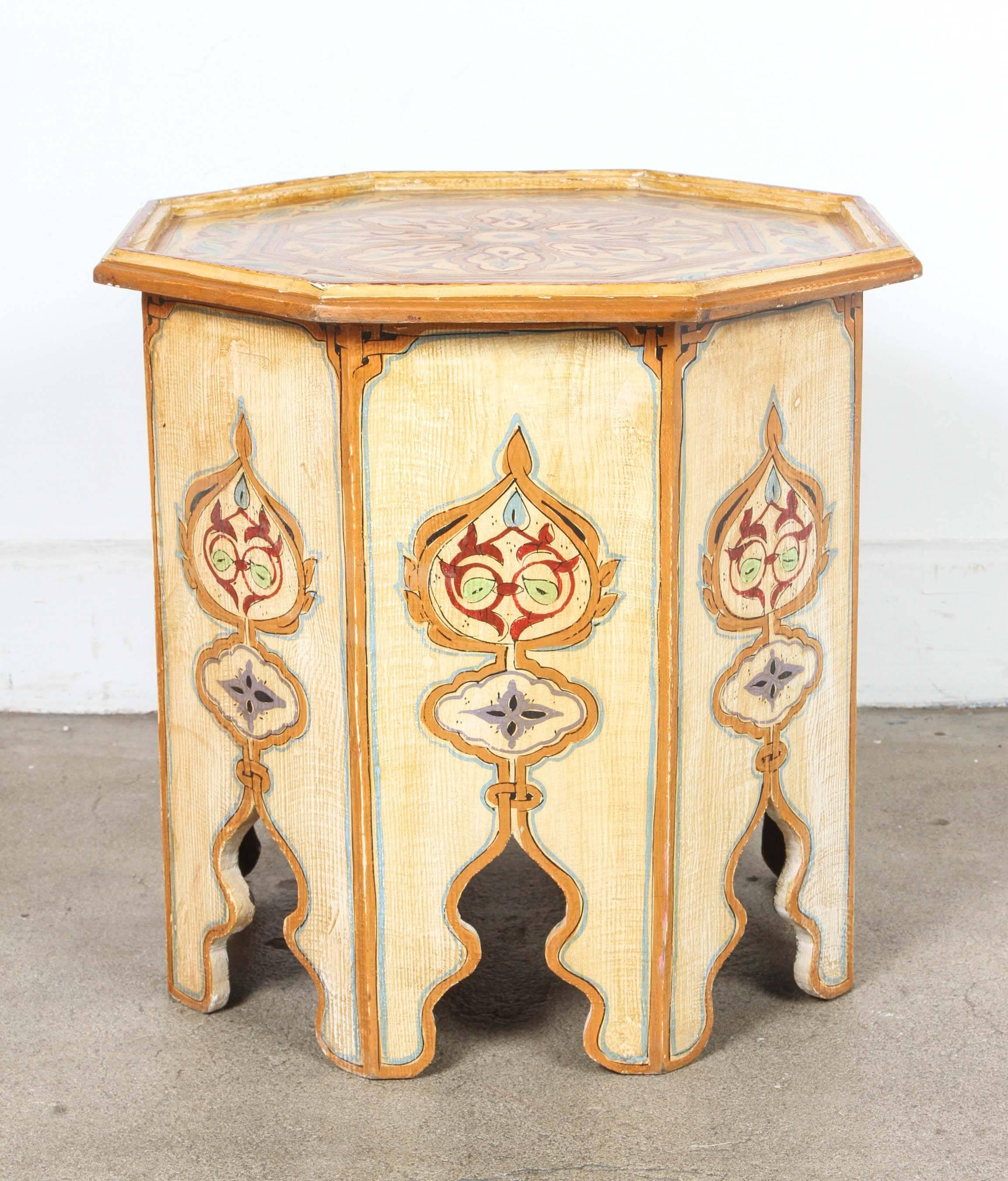 Moroccan ivory hand-painted side table with Moorish design.
Ivory background with multicolored floral and geometric designs.
Very fine artwork on an octagonal shape base.
This exotic side tables from Morocco will add a chic Boho accent in any