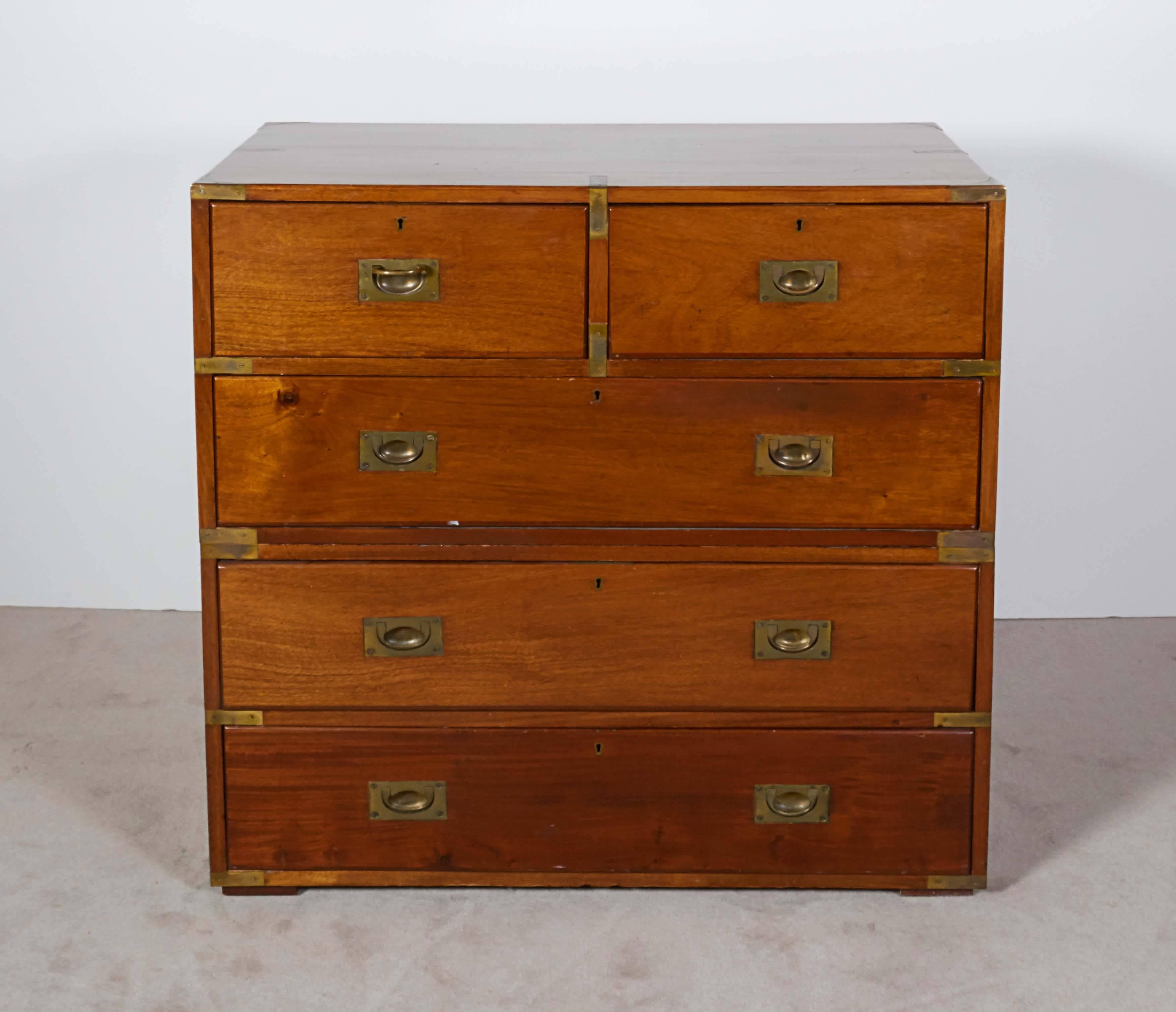 A pair of Victorian era American Campaign chests, manufactured circa 1860s, identical and handcrafted of mahogany with dovetail joinery, each with two short and three long drawers, accented with brass to pull handles and corners. Very good antique