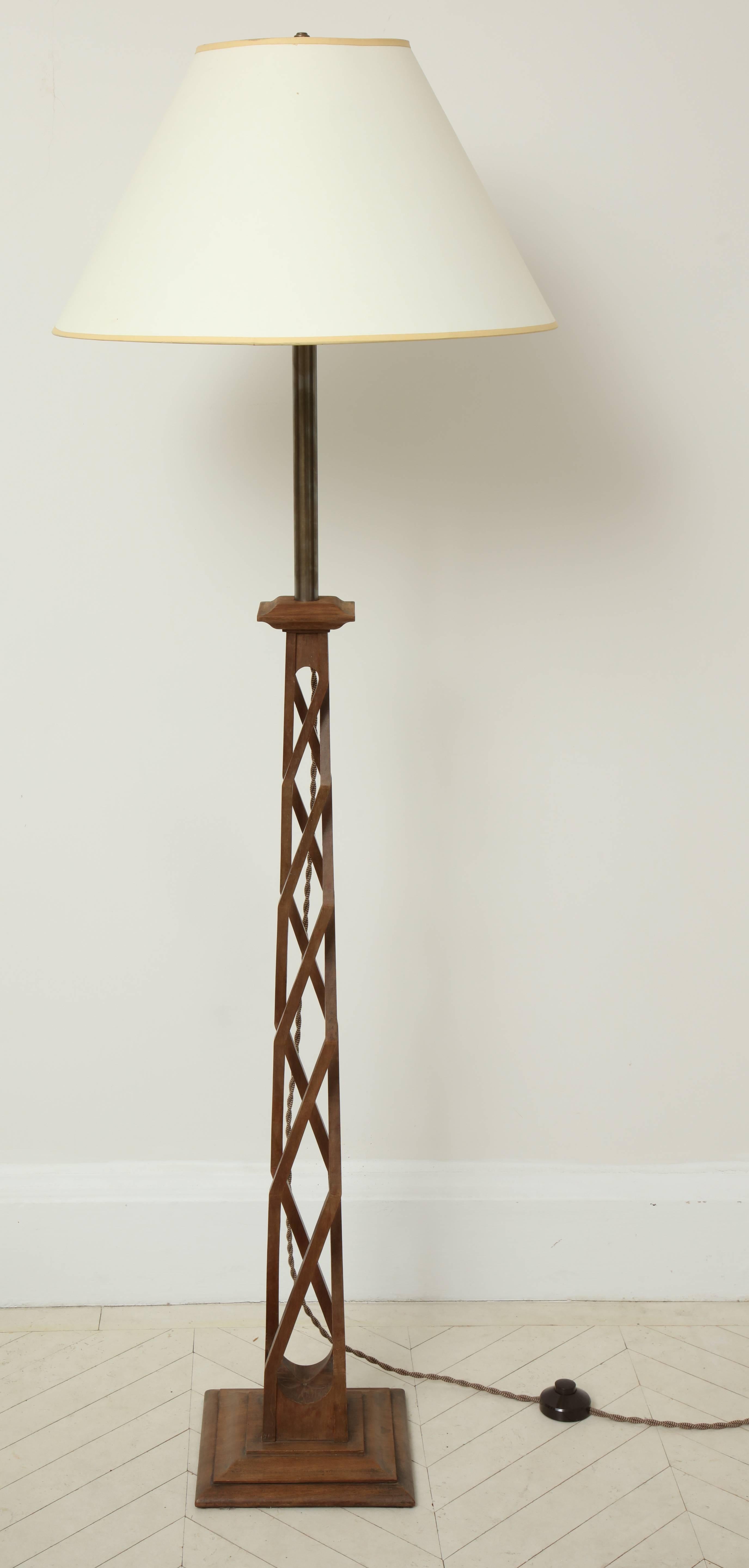 A 20th century English carved walnut helix base standing lamp.