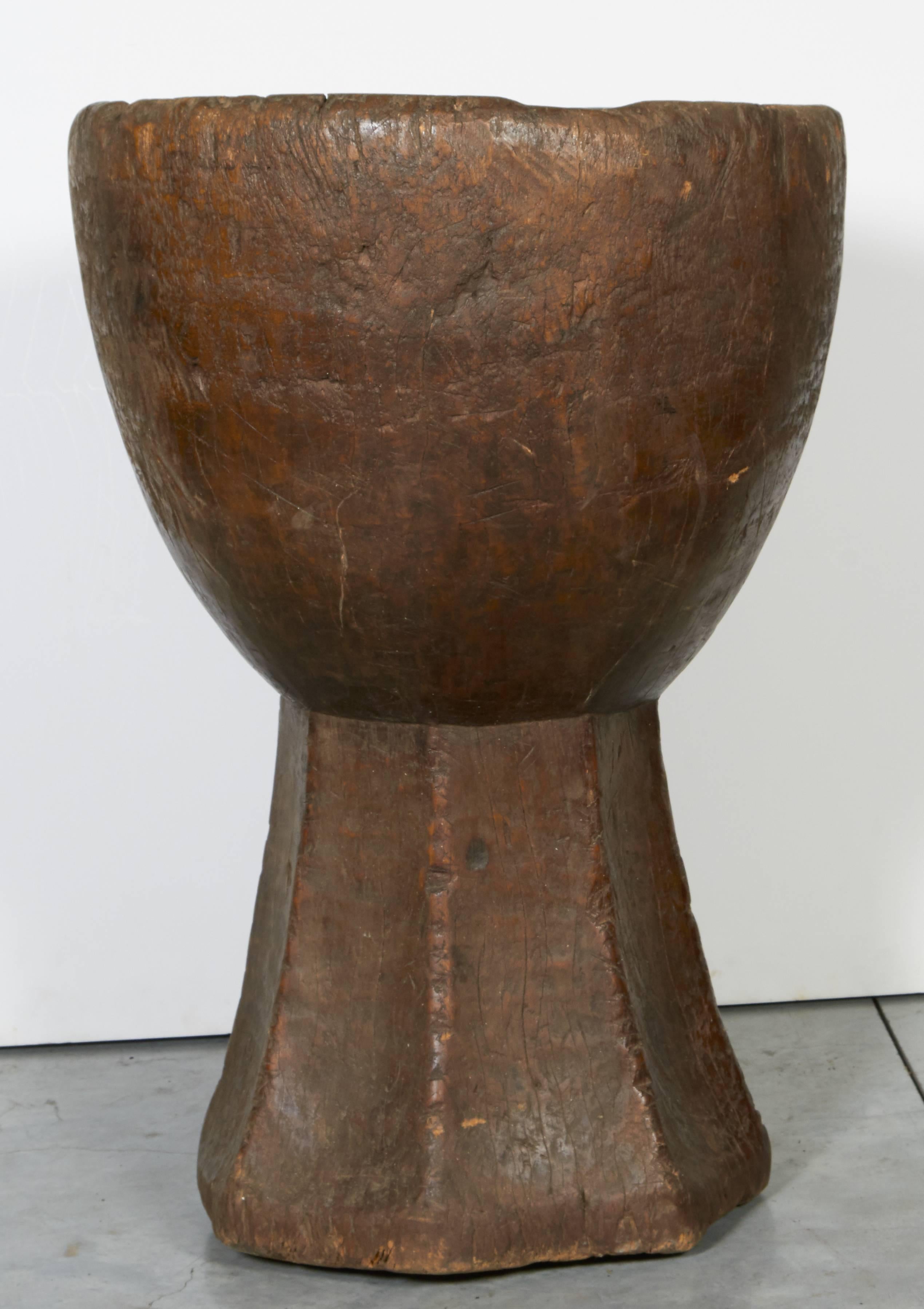 A gracefully shaped, wide mouth mortar with beautiful patina, carved out of a single piece of teakwood. From Java, Indonesia, circa 1930s.
M2020.